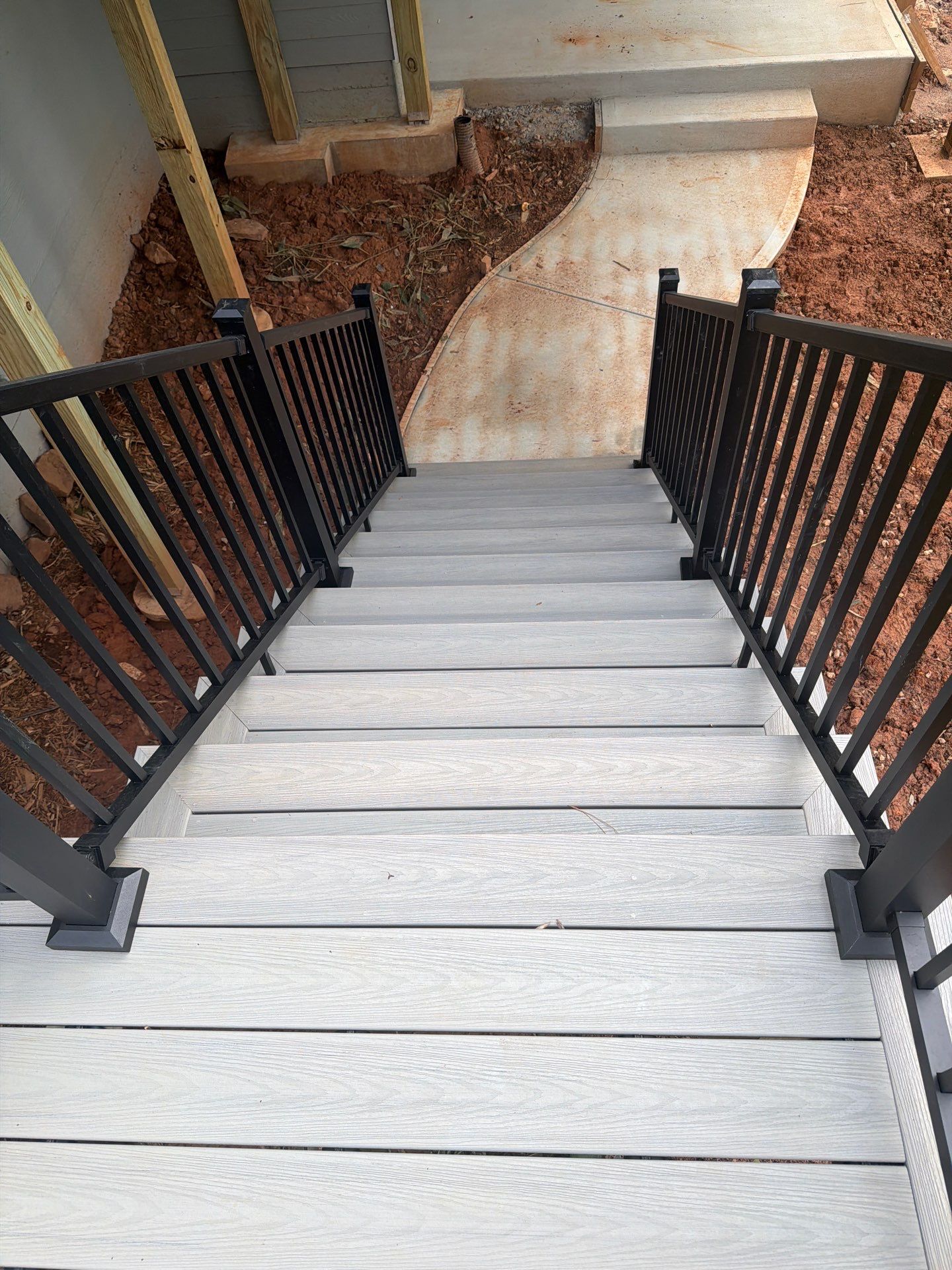 Covered Porch and Deck Build using Deckorators Venture Series Decking and Trex Select Aluminum Railing by Nelson Exteriors