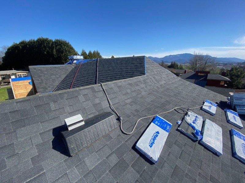 Residential Roofing Installation using Malarky Vista Midnight black by Top Notch Roofing Inc