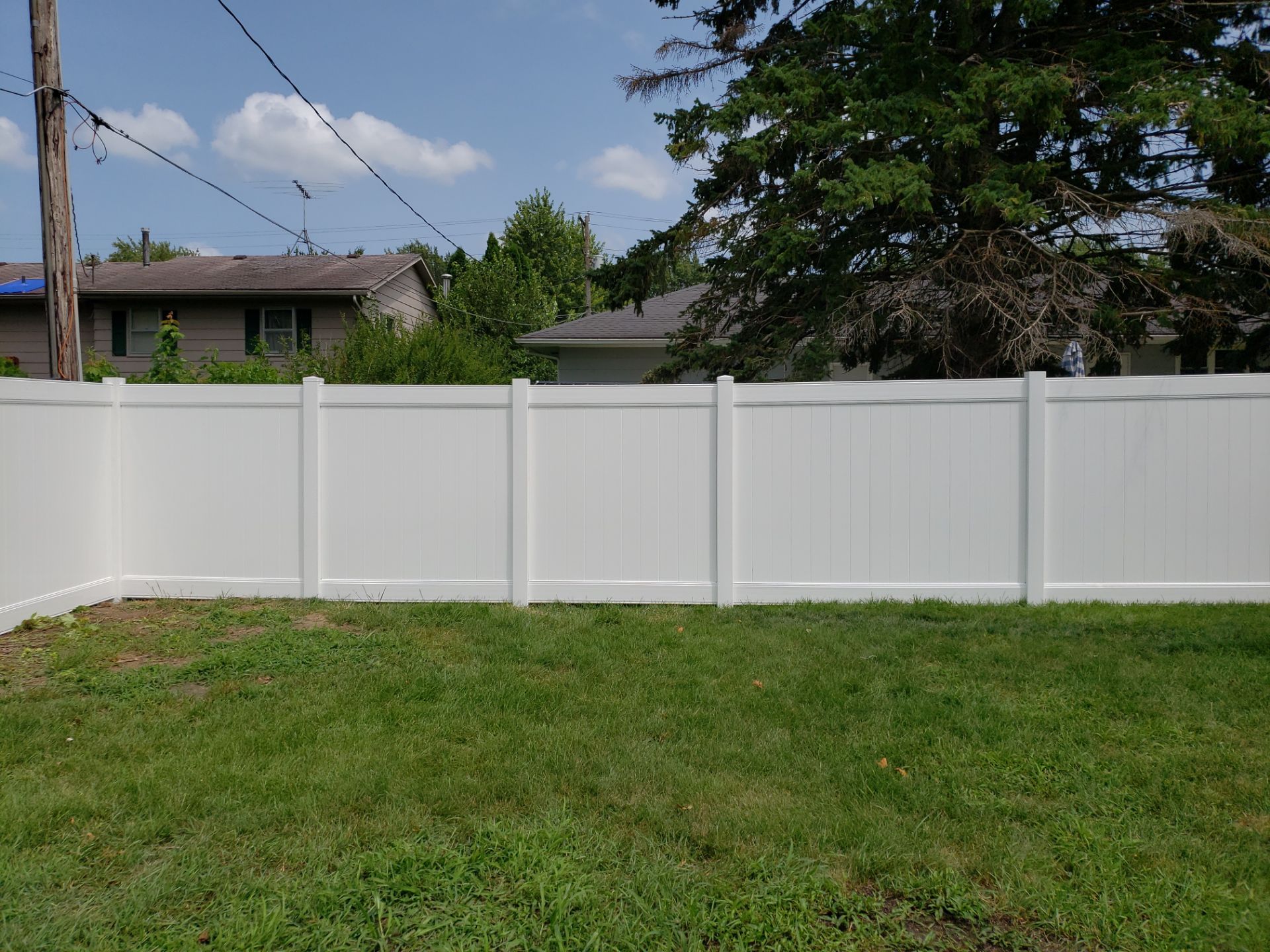 White Vinyl Privacy Fence Installation in Grundy Center by Perfect Picket Fence and Stain