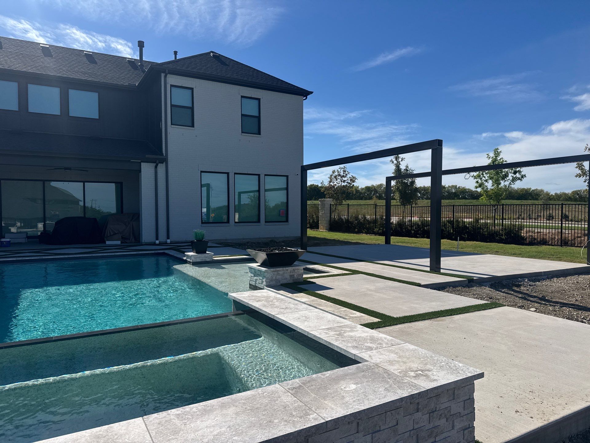 Modern Geometric Pool with Raised Spa, Tanning Ledge and Fire Bowls by Pinnacle Pools and Spas - DFW