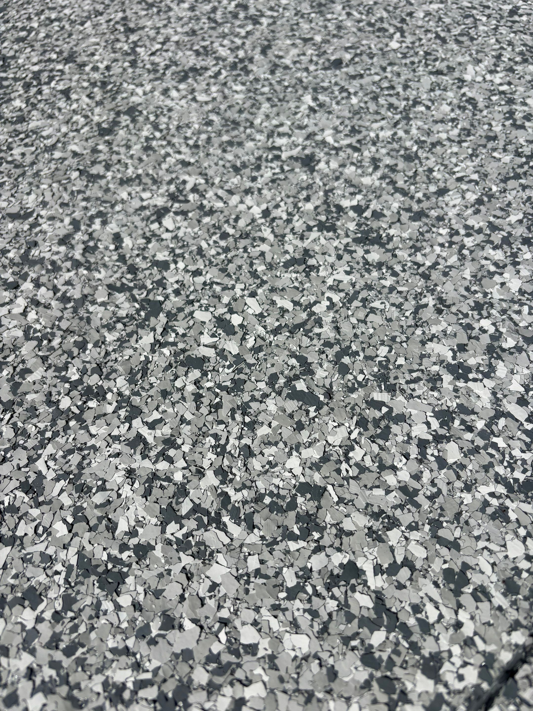 Three-Stall Garage Epoxy Floor Coating and LED Lighting in Lincoln by Goat Coatings