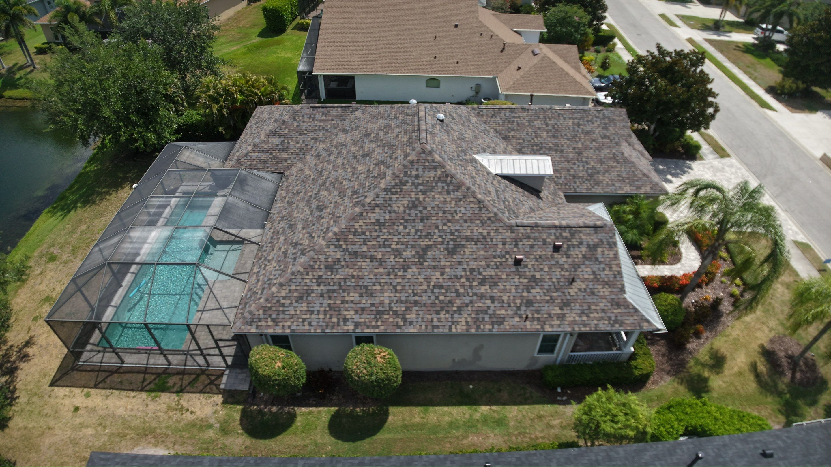 Architectural Summer Harvest Asphalt Shingle Roof Replacement in Bradenton, Florida by Trinity Restoration and Roofing LLC