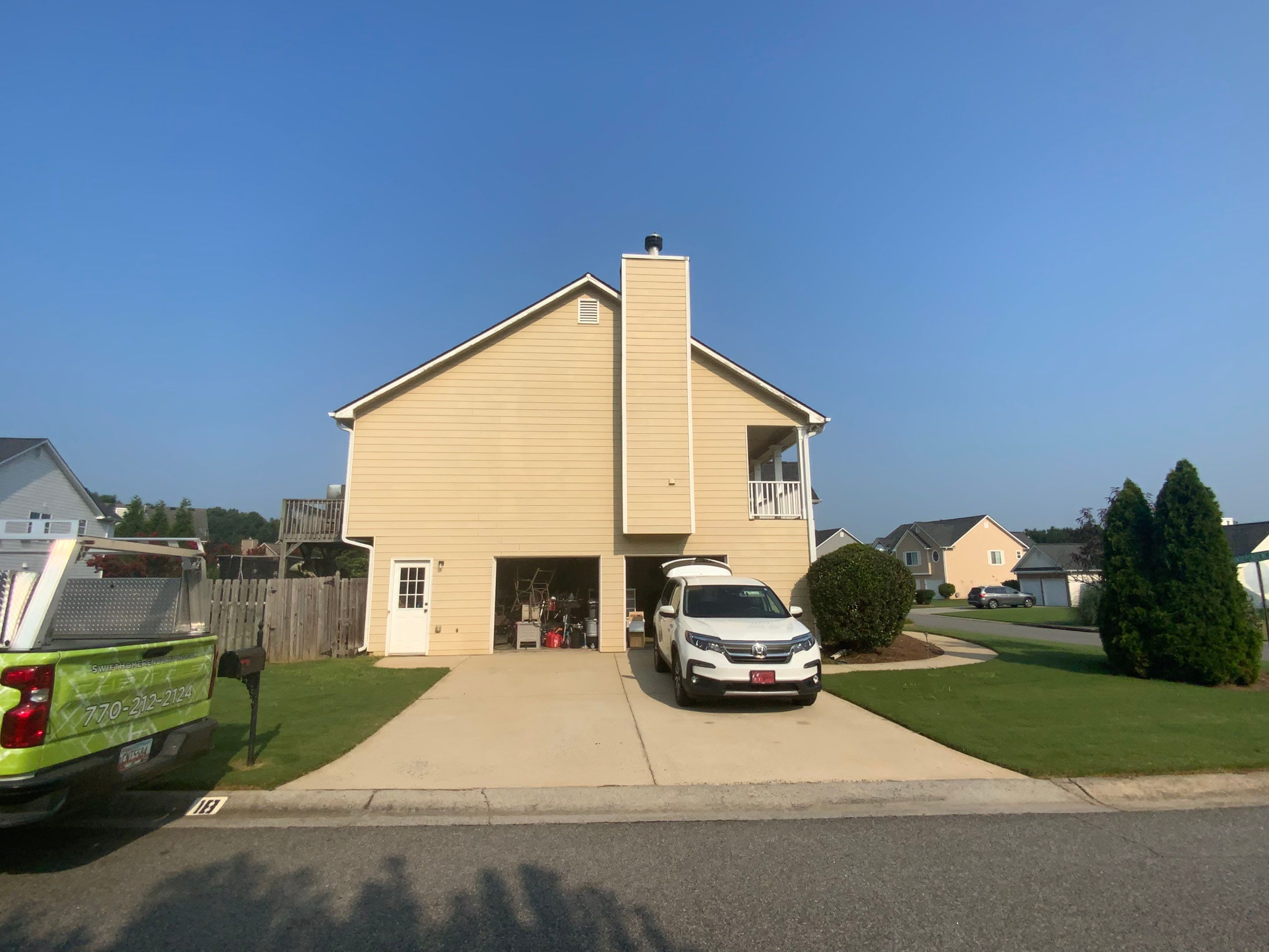 Comprehensive Exterior Painting for Cartersville Home with Blue Siding Transformation by Swift Home Renovations
