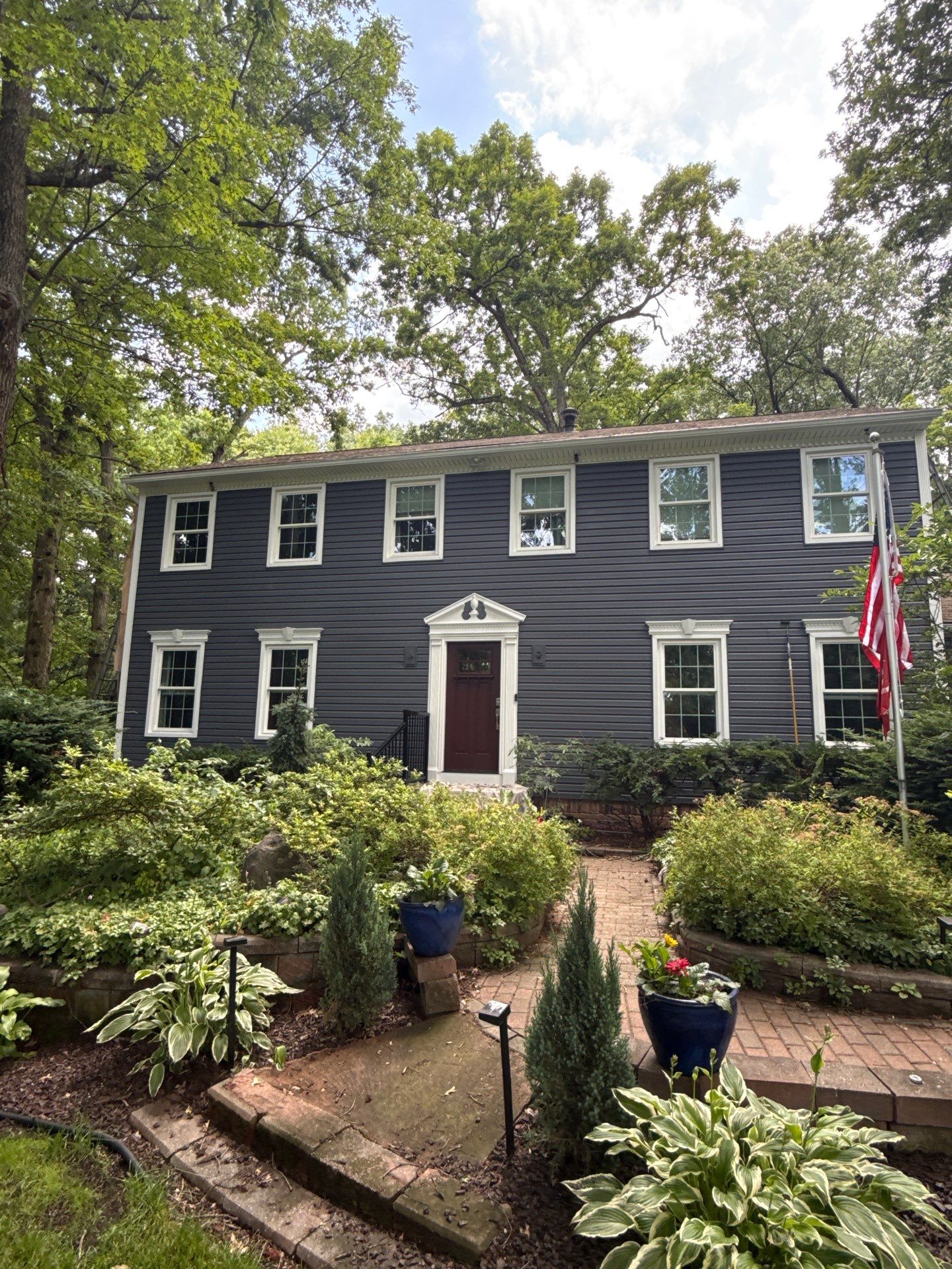 Vinyl Siding and Exterior Trim Repair for Brighton Residence by Top Shelf Painter