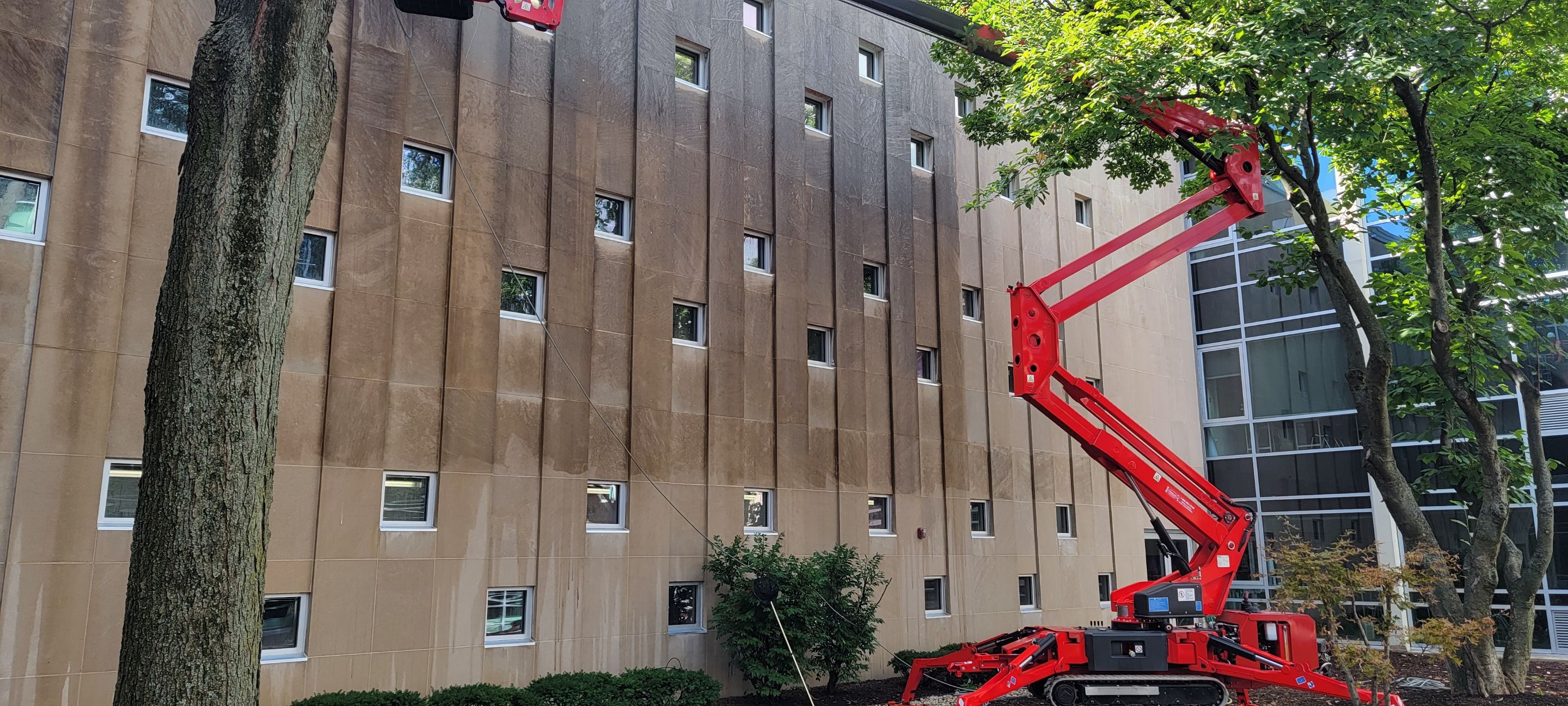 Courtyard pressure washing difficult access.  by Northern Power Washing LLC.