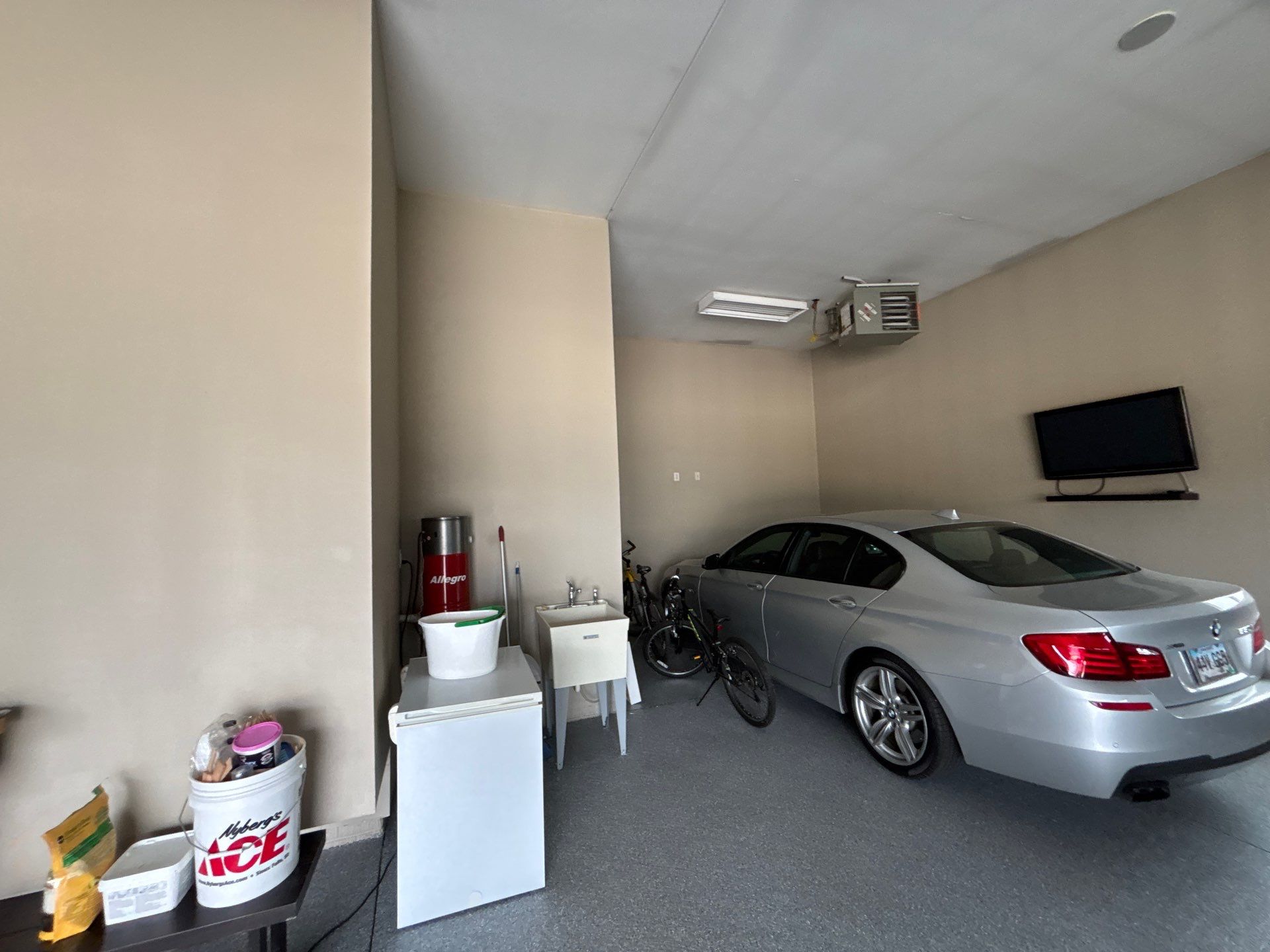 Speckled Grey Epoxy Garage Floor Coating Installation in Tea by Select Painting, Coatings & Garage Cabinets