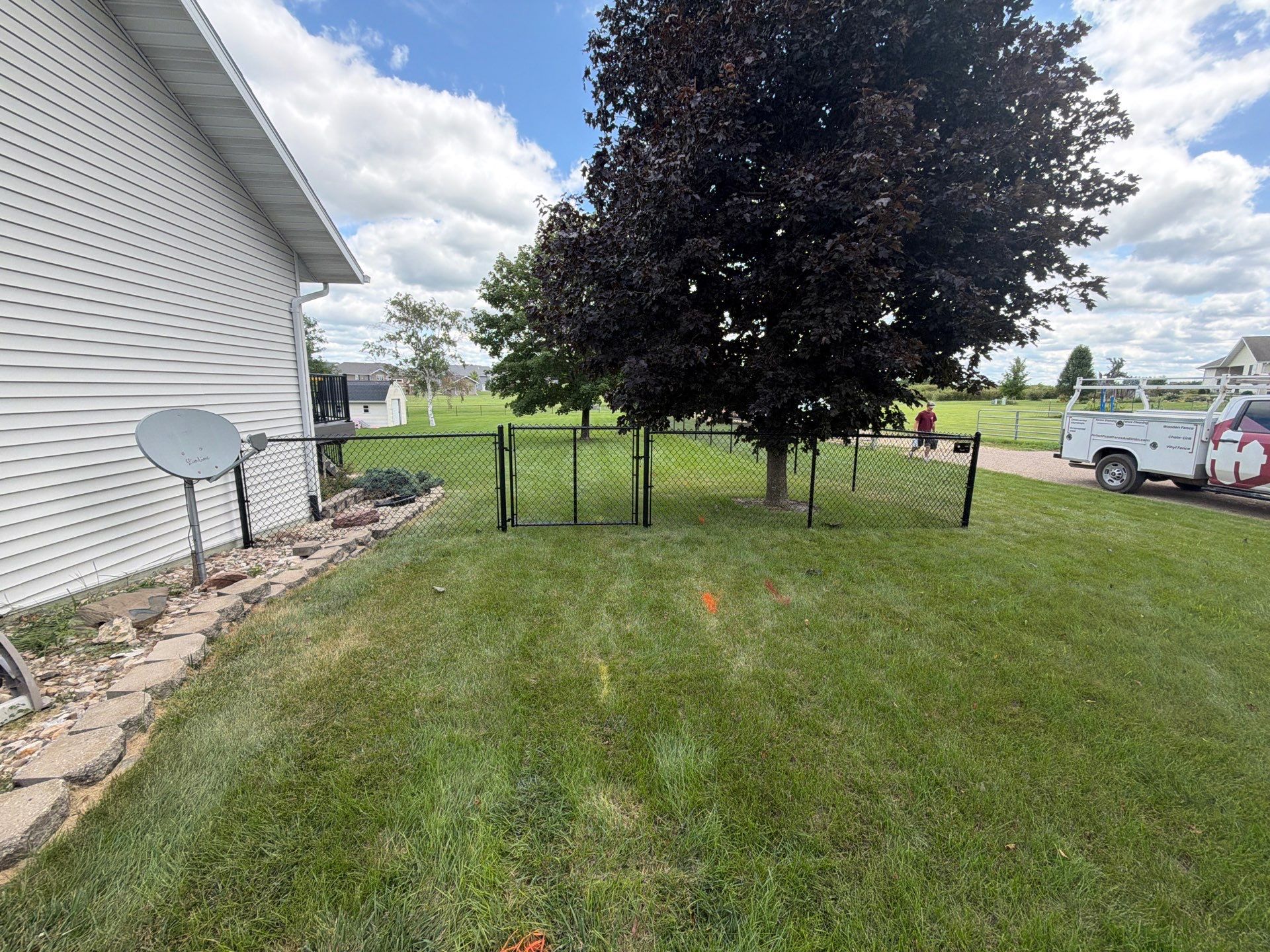 Black Vinyl-Coated Chain Link Fence Installation in Fairbank by Perfect Picket Fence and Stain