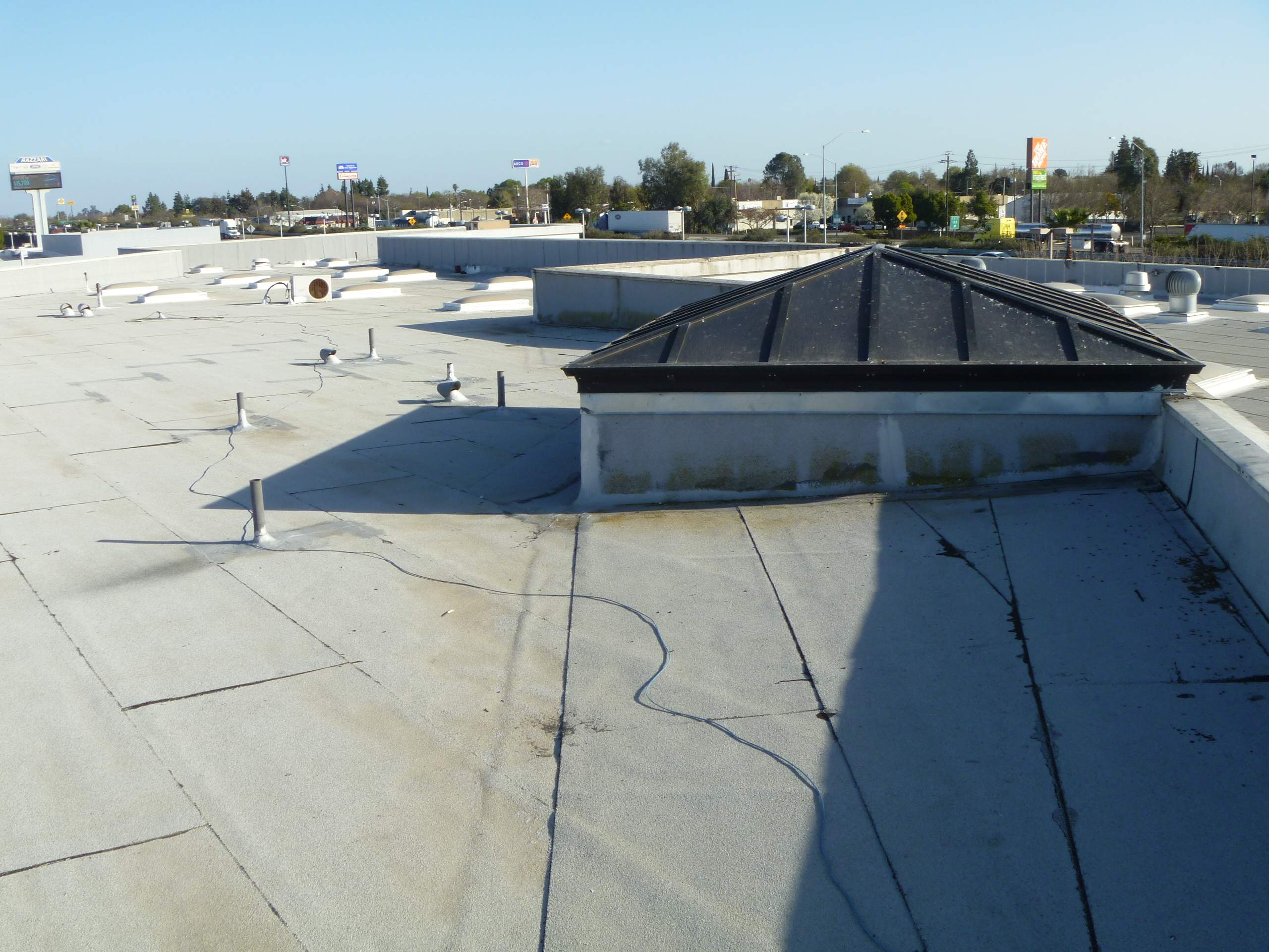 Commercial Roofing Installation using Spray foam and Conklin Benchmark/PUMA XL 18 yr warranty coatings by Straight Edge Roofing Inc