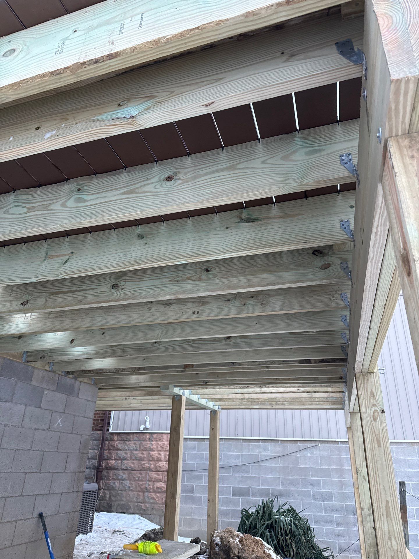 Deck and door by Cousins Roofing Siding & Decks