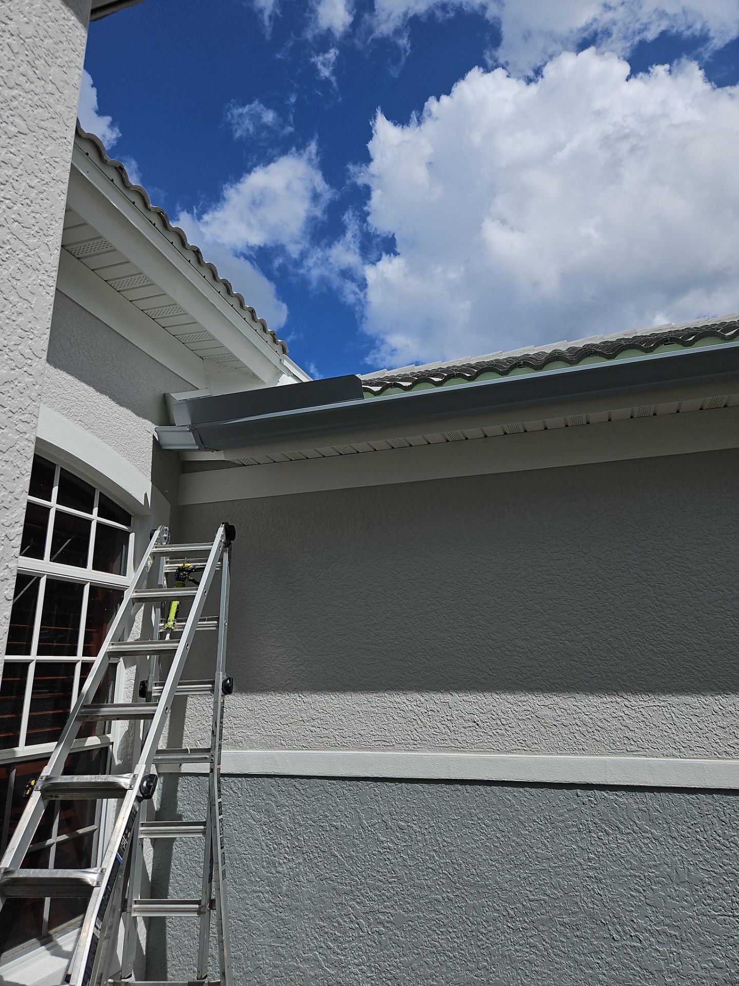6-inch K-style Seamless Gutters and Splash Guard in Grey Color in Naples FL by Gutter Professors
