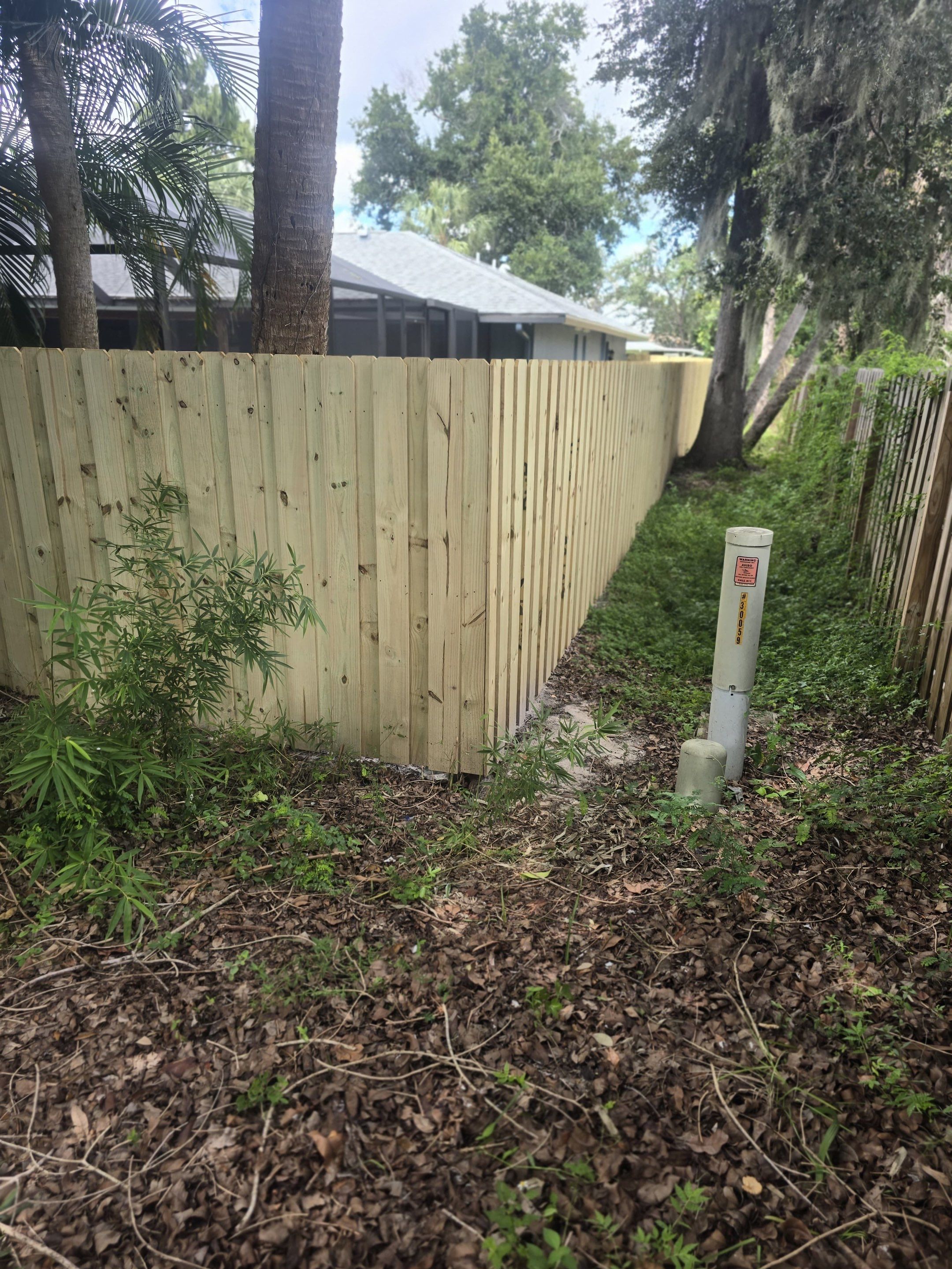 Wood Privacy Fence Installation with Double Gate in Port Charlotte by True Fence LLC