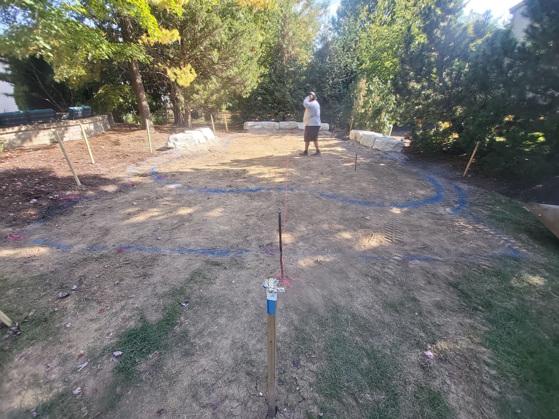 Custom Backyard Putting Green around Landscape Boulders in Hilliard by Southwest Greens Midwest