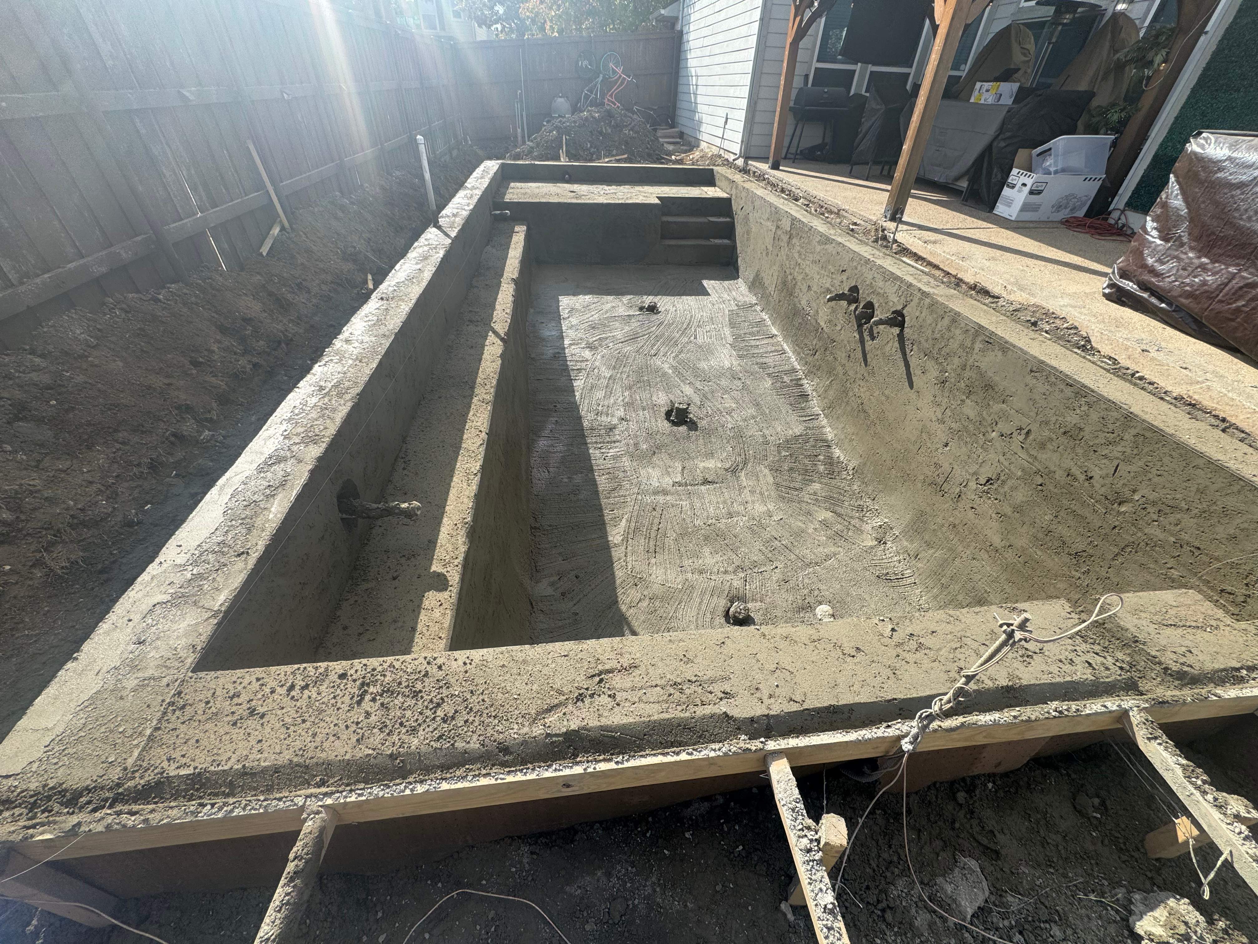 Pool with Turf and Raised Wall by Pinnacle Pools and Spas - DFW