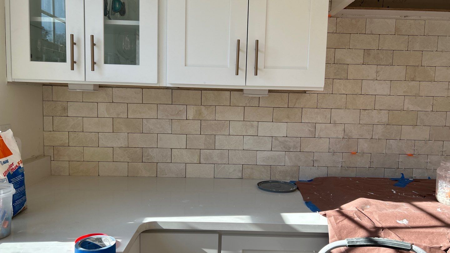 Lovely neutral backsplash  by Footprints Floors of Nashville