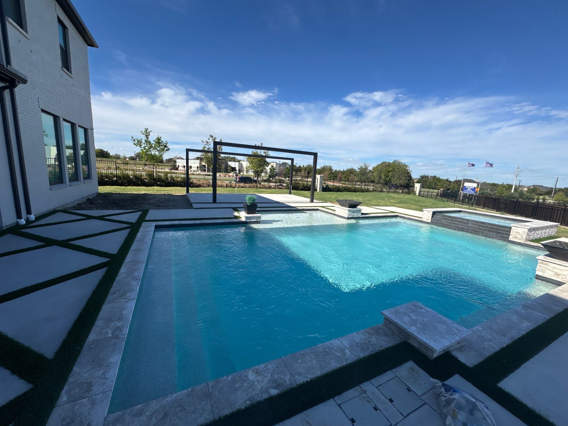 Modern Geometric Pool with Raised Spa, Tanning Ledge and Fire Bowls by Pinnacle Pools and Spas - DFW