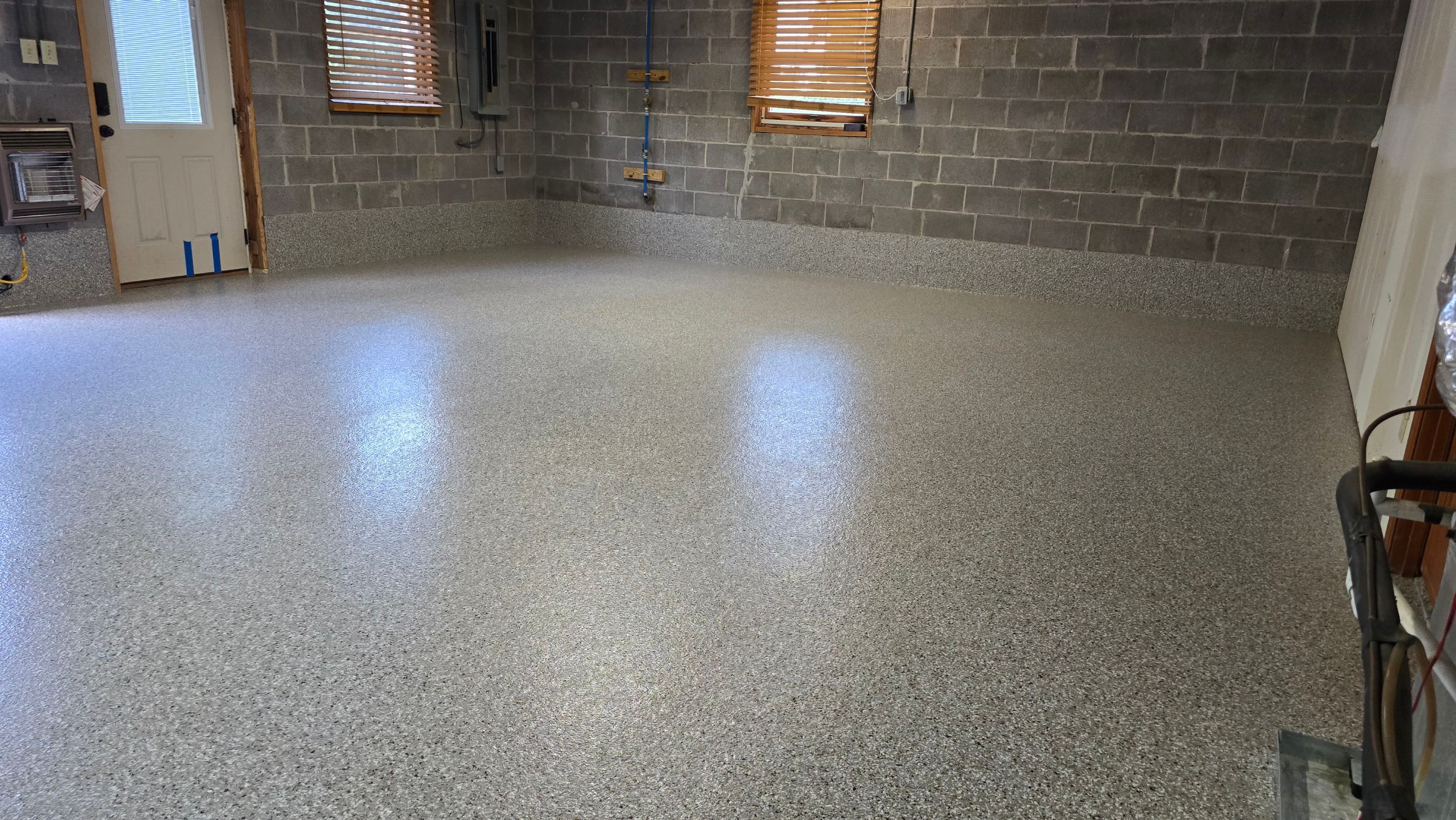Garage & Porch Using Creekbed by Elite Floor Solutions