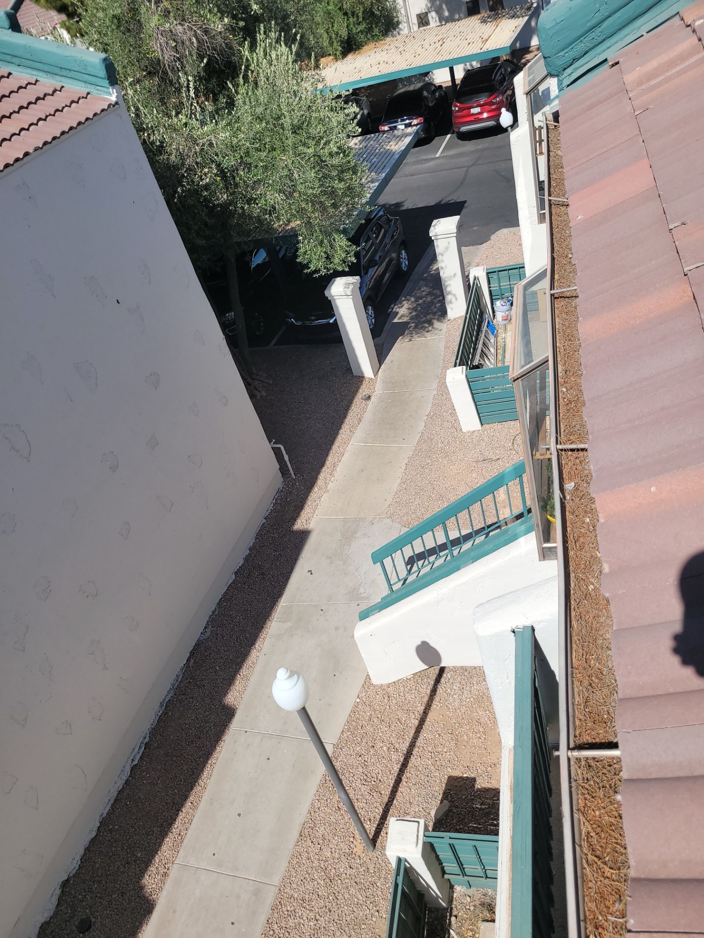 HOA gutter cleaning in Sun City & Surprise, AZ before  photo showing full gutters.