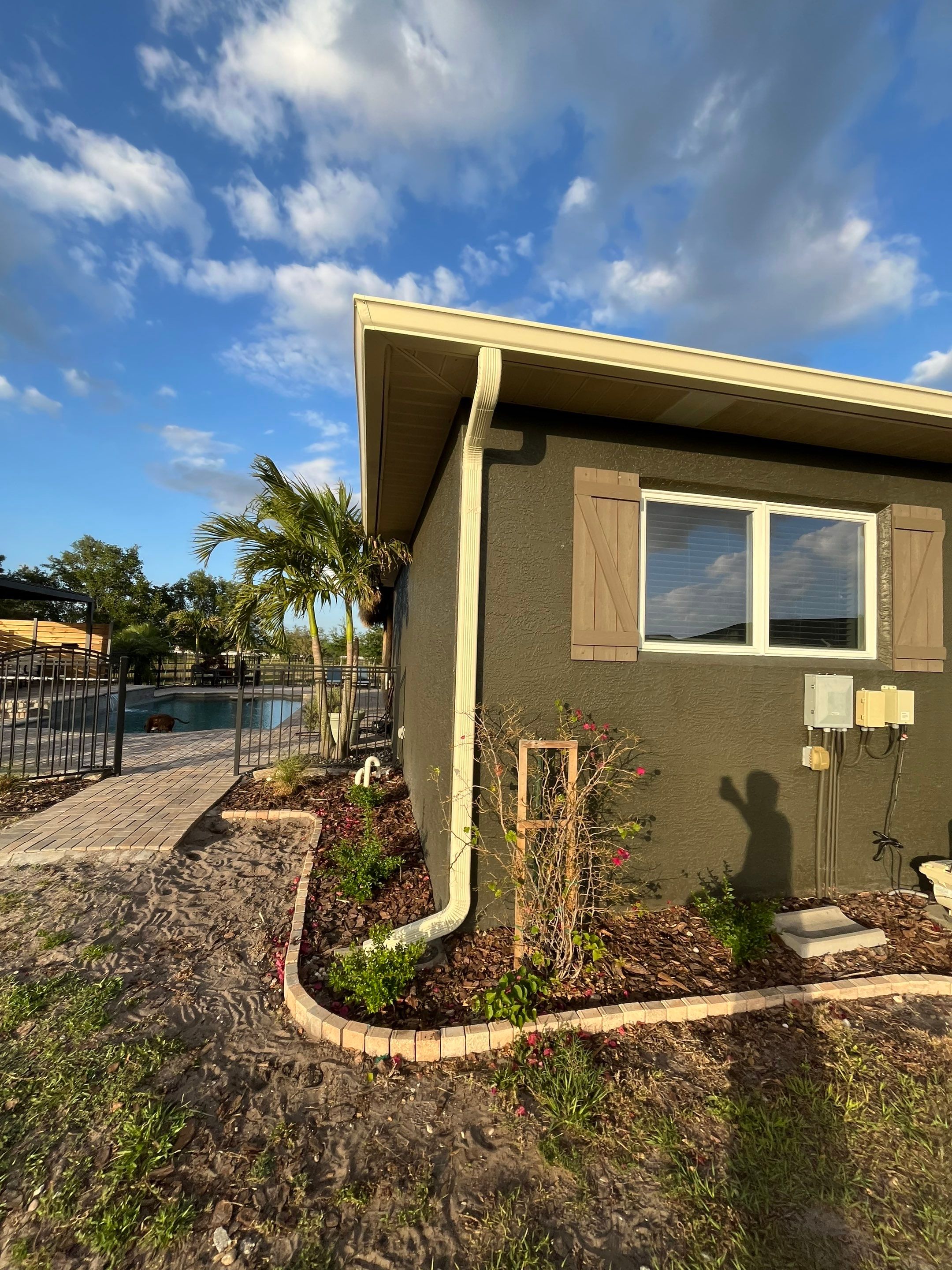  7-inch White seamless gutters and downspouts in Myakka City FL by Gutter Professors