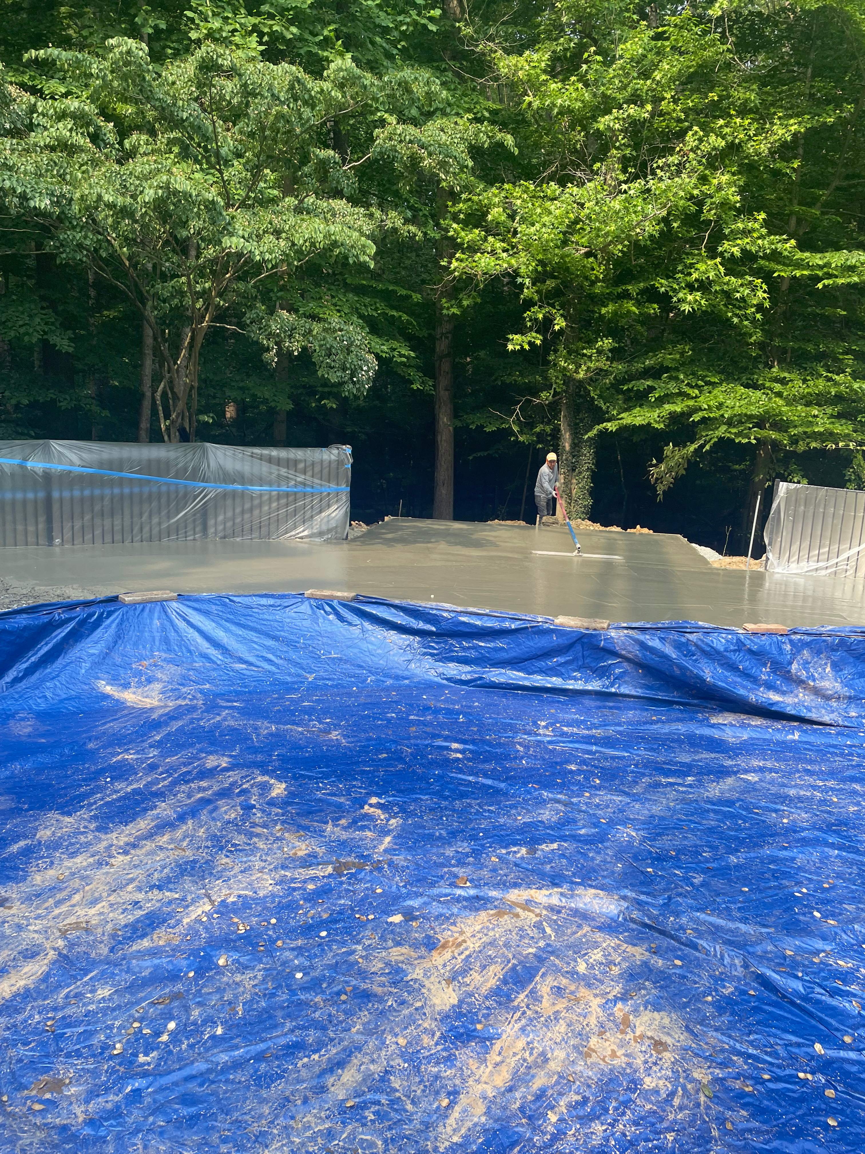 Pool Surround remodel with retaining walls, new waterfall and water slide by Fairfax Contractors, LLC