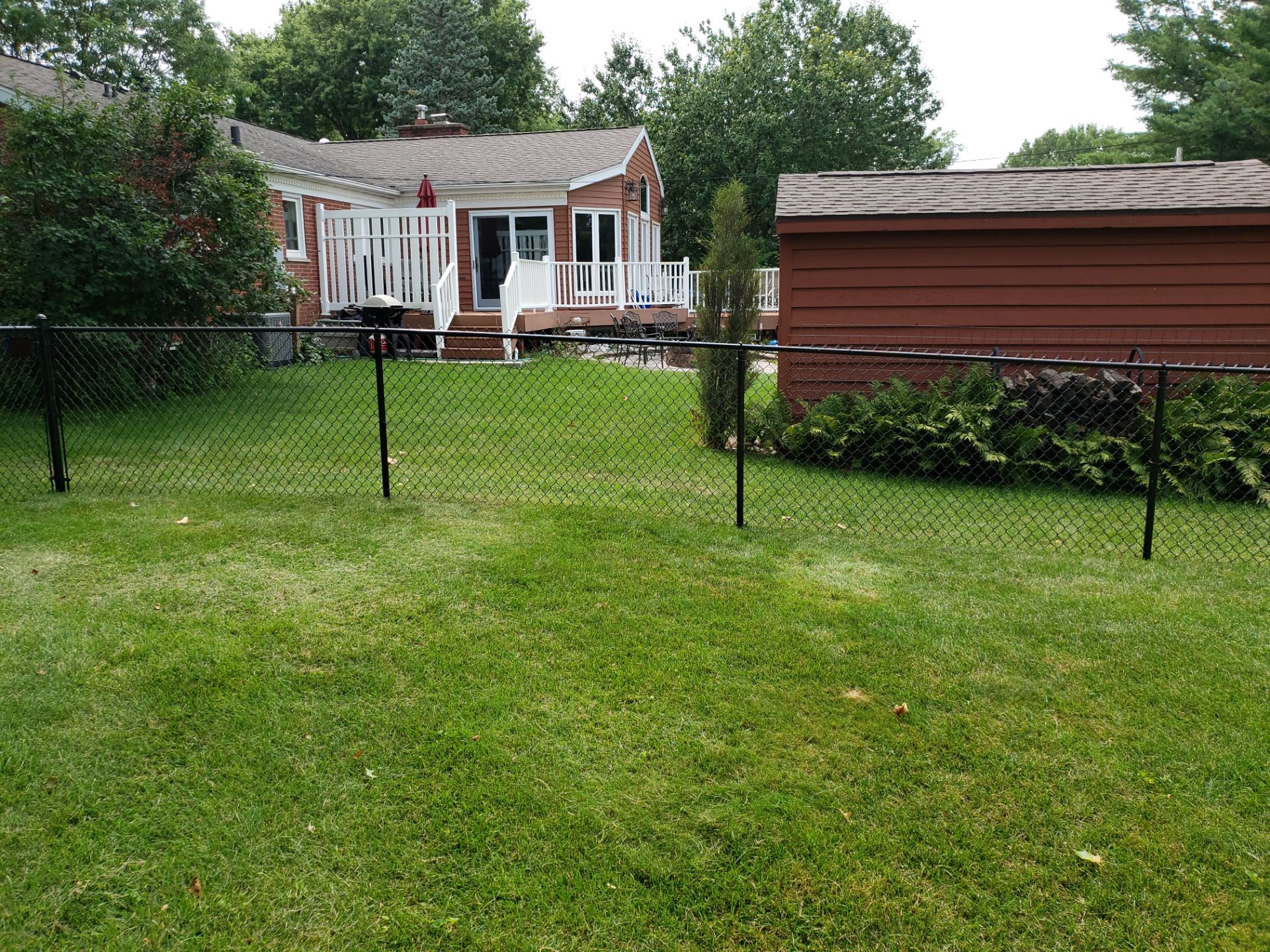 Black Chain Link Fence Installation in Cedar Falls by Perfect Picket Fence and Stain