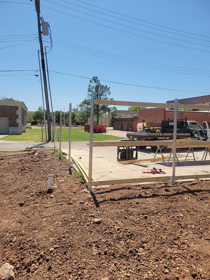 Cedar Fence using Cedar Pickets and Metal Poles by Clays Services Inc