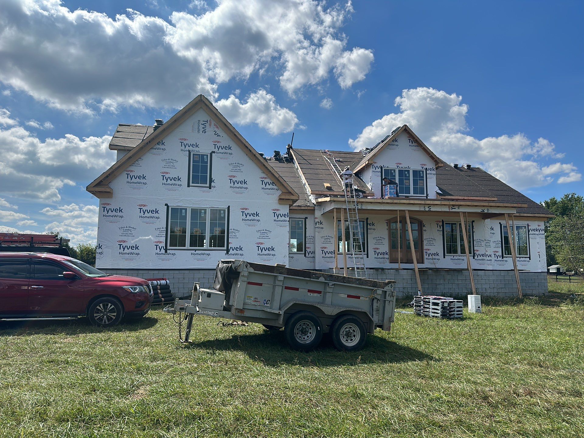 Residential Roofing Installation using Tamko Heritage AR with Standing Seam Metal Porch by Undersun Roofing 
