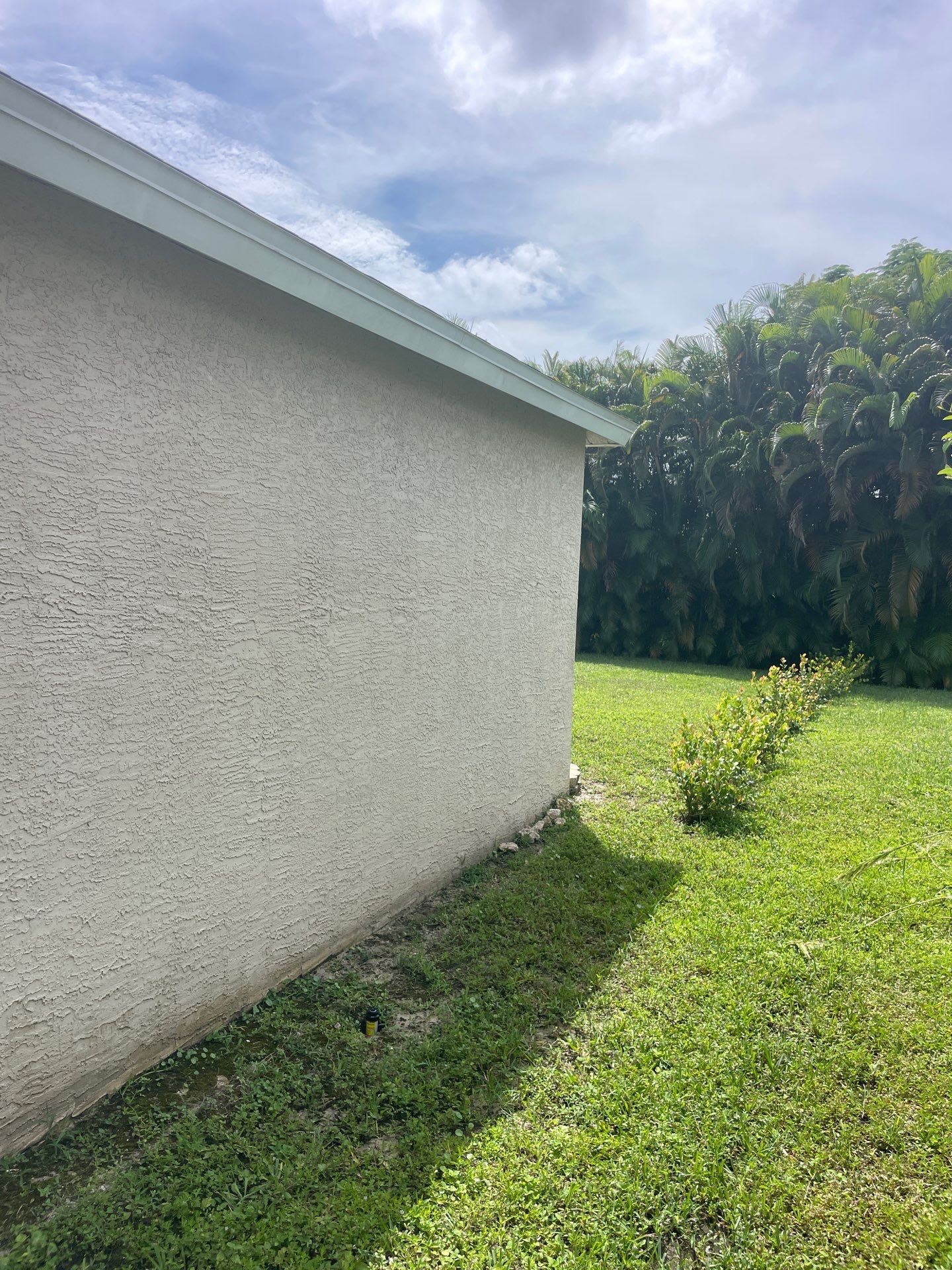 White Aluminum Seamless Gutters and Downspouts in Estero FL by Gutter Professors