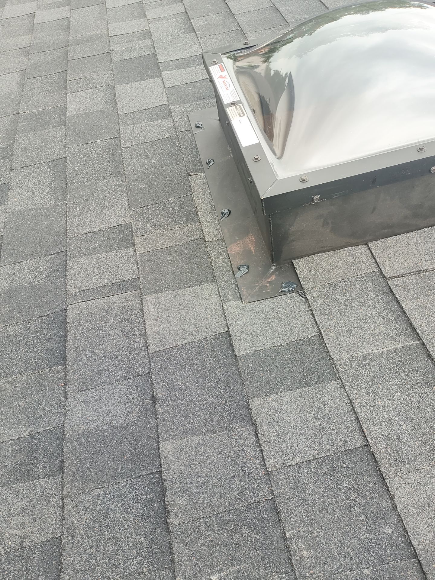 Nothing looks nicer than a little black roof by Bayfront Roofing and Construction