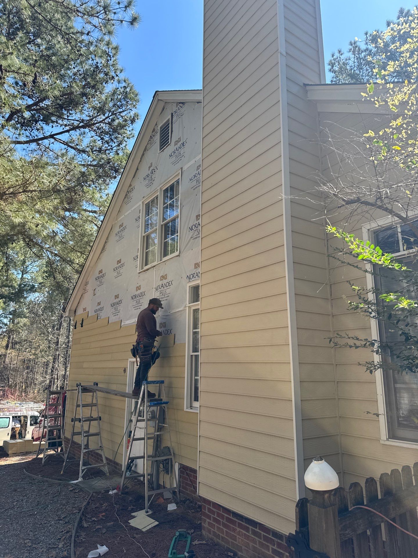 Exterior paint and siding replacement by GonzalezPainters & Contractors Inc 