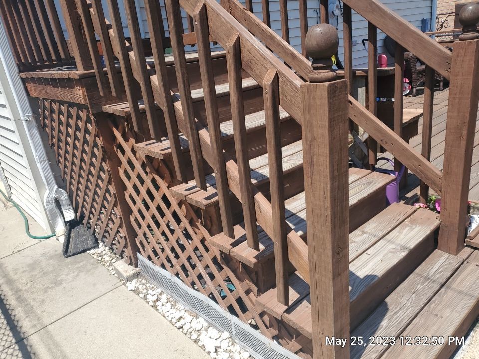 Wood cleaning and staining using Armstrong cloark oil stain by Northern Power Washing LLC.