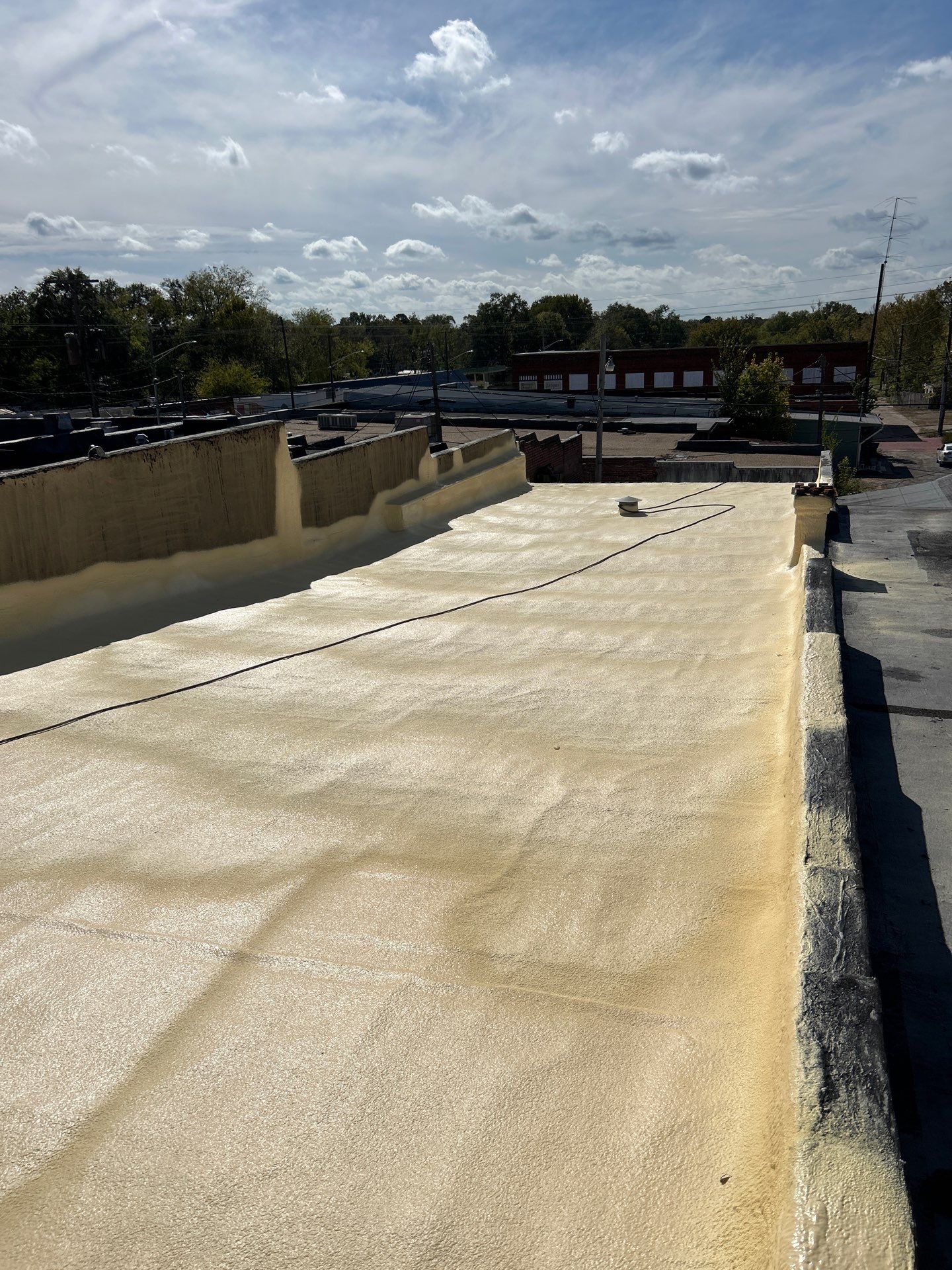Downtown Gladewater Commercial Foam Roof Restoration – SPF + High-Tensile Acrylic by All Star Roofing LLC
