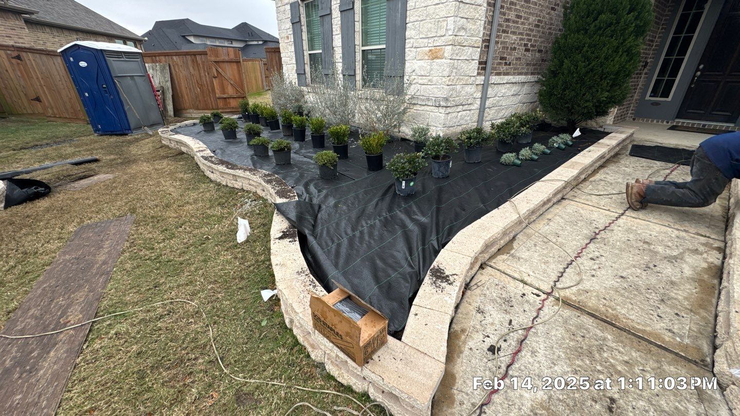 🌿✨ Darlene & Andrew’s Amazing Curb Appeal Transformation  Some projects are more than just landscaping—they’re a conversion of curb appeal from the ground up. For Darlene & Andrew, Alejandro and the Texas Urban Team designed and delivered a complete solution that reshaped their flower beds, solved drainage challenges, and gave new life to the sideyard.  💡 From planning to execution, every step was tailored to build both beauty and functionality:  🌸 Flower Beds, Reinvented  Demolition of old beds, plants, and mulch.  Fresh soil preparation, weed protection, and a brand-new retainer wall built with hand-cut stone and decorative caps.  Carefully selected plants and garden mix to ensure health and visual harmony.  💧 Drainage & Irrigation Upgrades  Outdated corrugated pipes replaced with PVC drainage lines to carry water safely away from the foundation.  New irrigation system combining drip lines and sprinklers—watering plants while keeping the house walls protected.  Sideyard drainage extended with catch basins and PVC piping to prevent water pooling and foundation stress.  🚶 Functional Sideyard with Walkway & Trash Area  Graded and leveled sideyard to manage runoff.  Installed a modern gravel and paver walkway for easy access.  Built a firm and tidy concrete-paver pad for trash containers—making the space both practical and polished.  🛠️ Stonework & Craftsmanship  Every stone in the retainer wall was cut, set, and secured by the team of handcrafters, ensuring a durable build that doubles as a design statement.  ✅ Outcome: Darlene & Andrew’s property now has better drainage, a clean and organized sideyard, and elegant new flower beds—all designed for long-term durability and lasting beauty.  📢 Before hiring anyone, review our portfolio. Our work speaks louder than words—each project is a blend of function, protection, and design crafted to last. by Texas Urban Elements