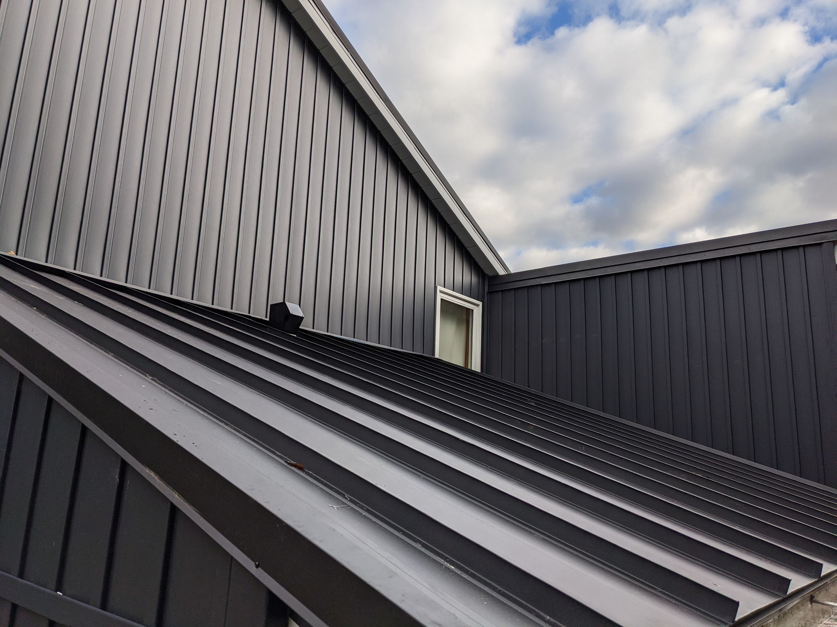 Residential Roofing Installation using 16" Standing Seam Panels by Jay Carter Roofing & Sheet Metal