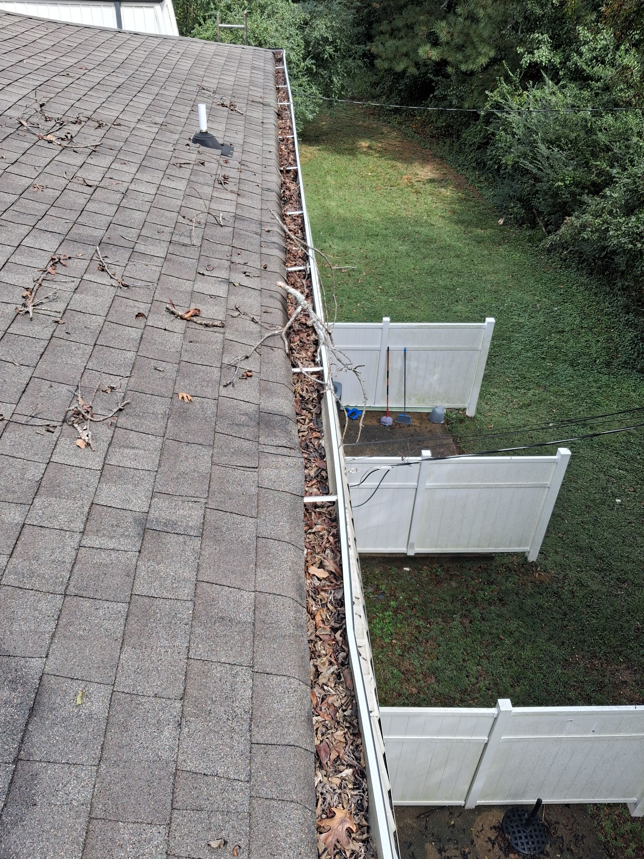 Commercial gutter cleaning Chattanooga before photo with filled gutters
