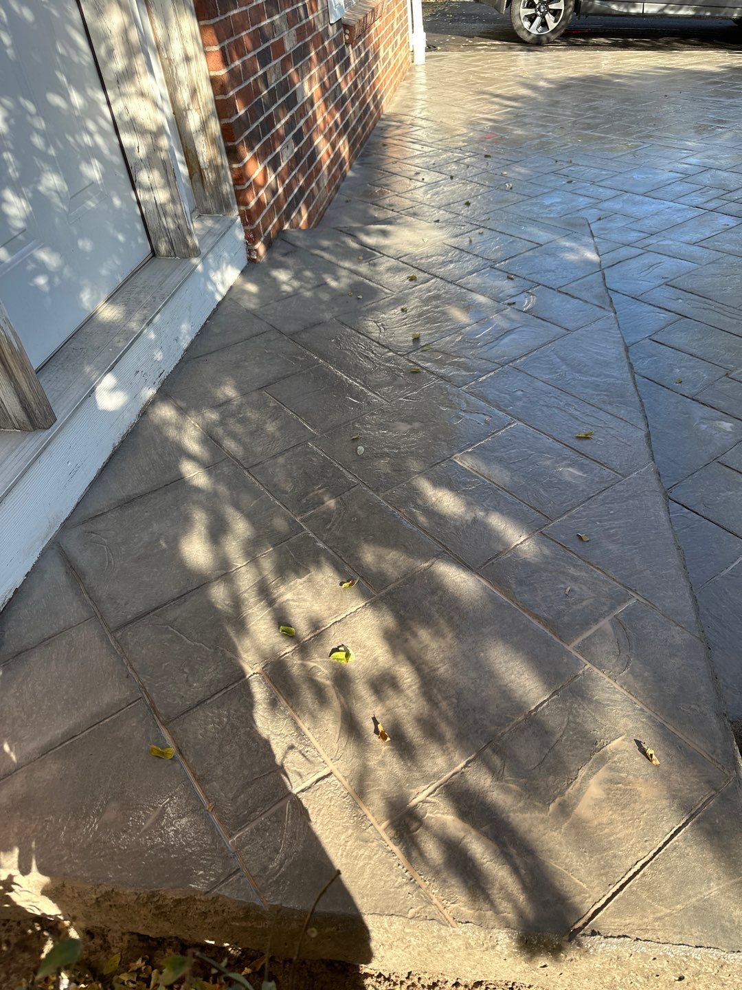 Ashlar slate stamped concrete patio  by NG Masonry & Construction LLC