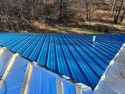 Residential Roofing Installation using Custom Metal and insulation
