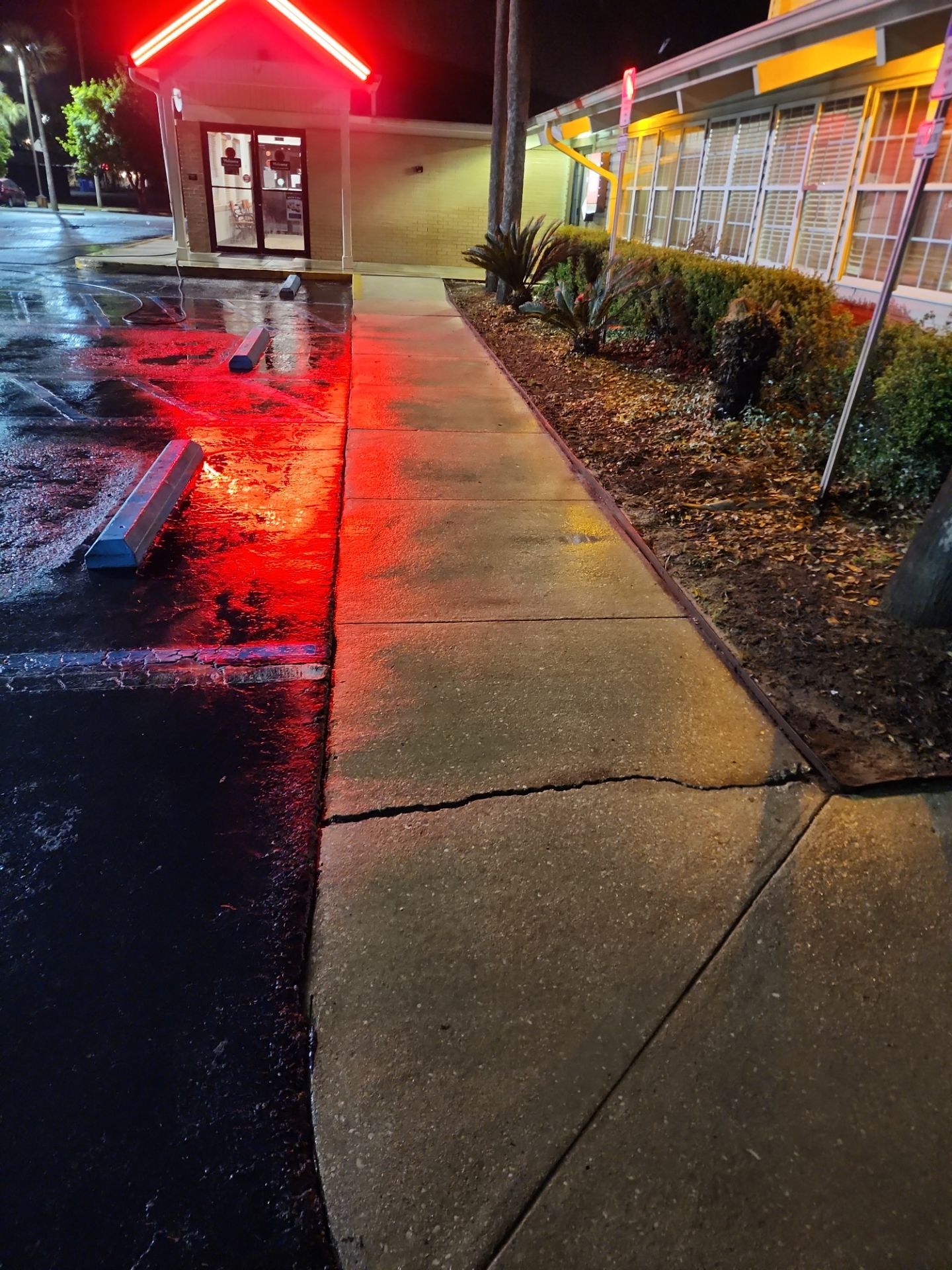 Concrete Sidewalk Parking Lot Curb After AquaTech Cleaning