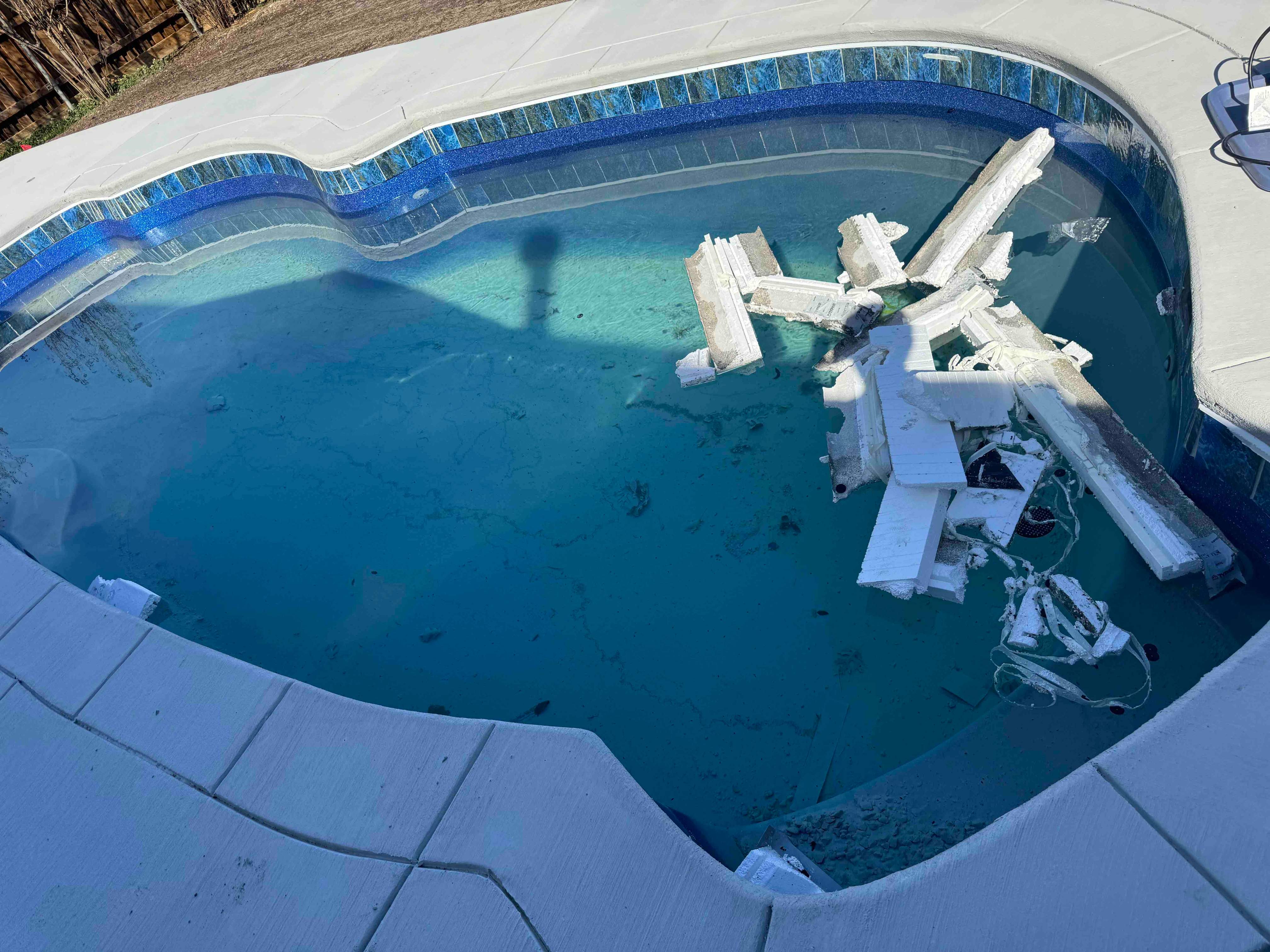 Freeform Pool with Raised Spa and Blue Tile by Pinnacle Pools and Spas - DFW