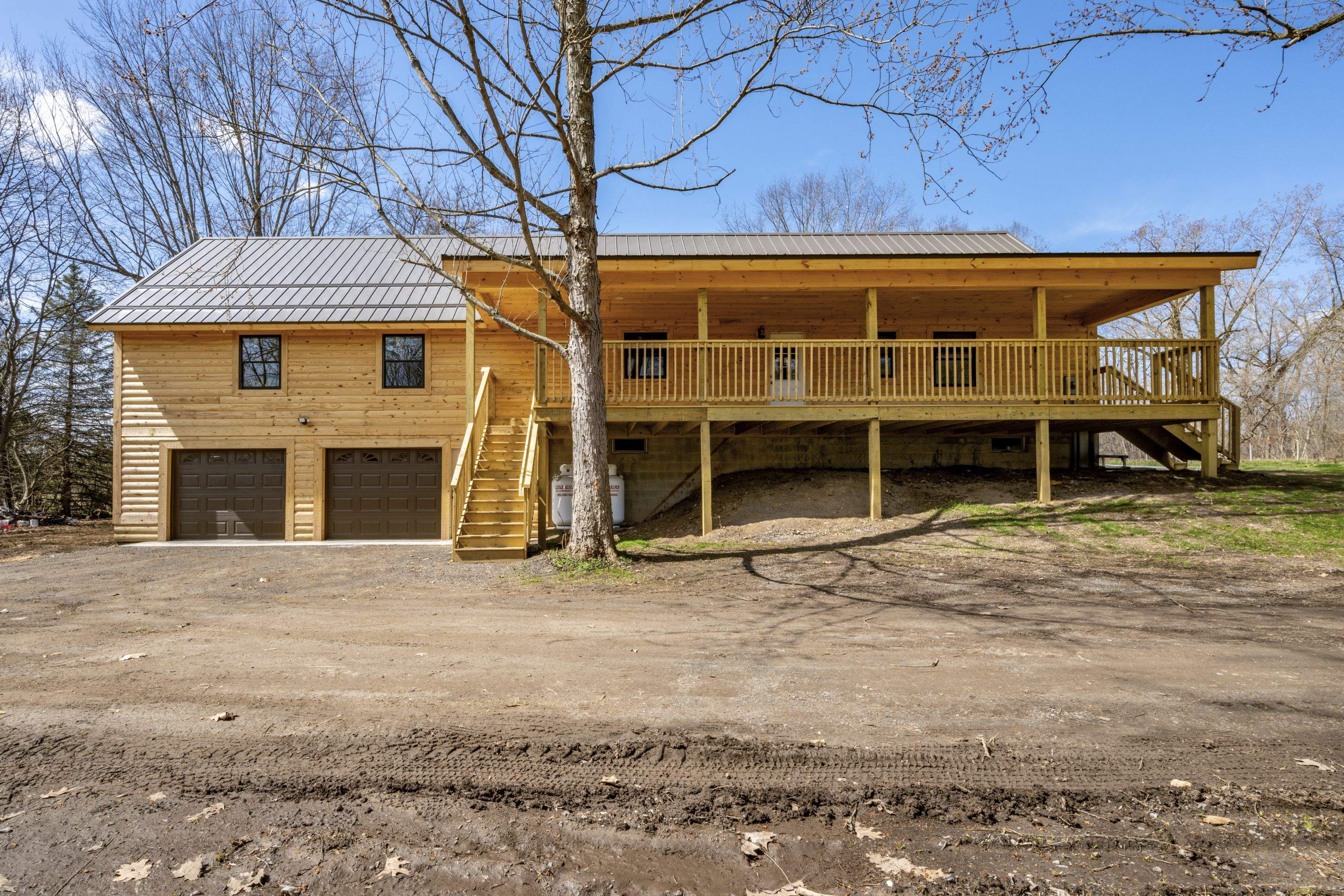 New Addition to Home using Log Cabin Siding  by Horst Custom Homes 