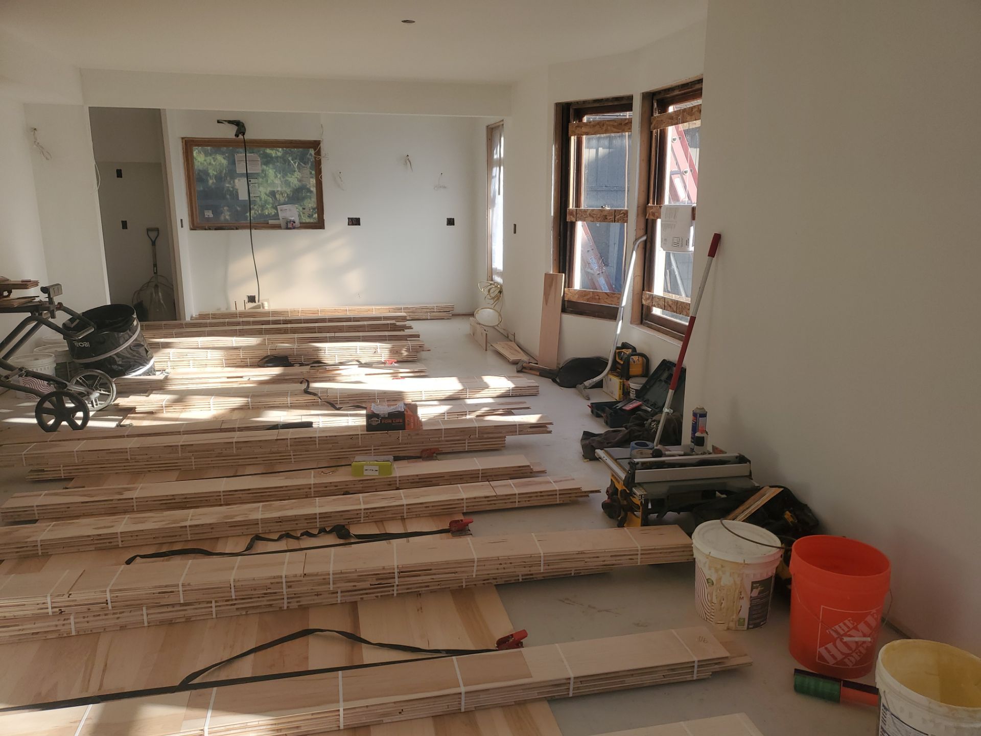 Full glue down Installation over radiant heat 7" Maple character grade by Ann Arbor Hardwoods 