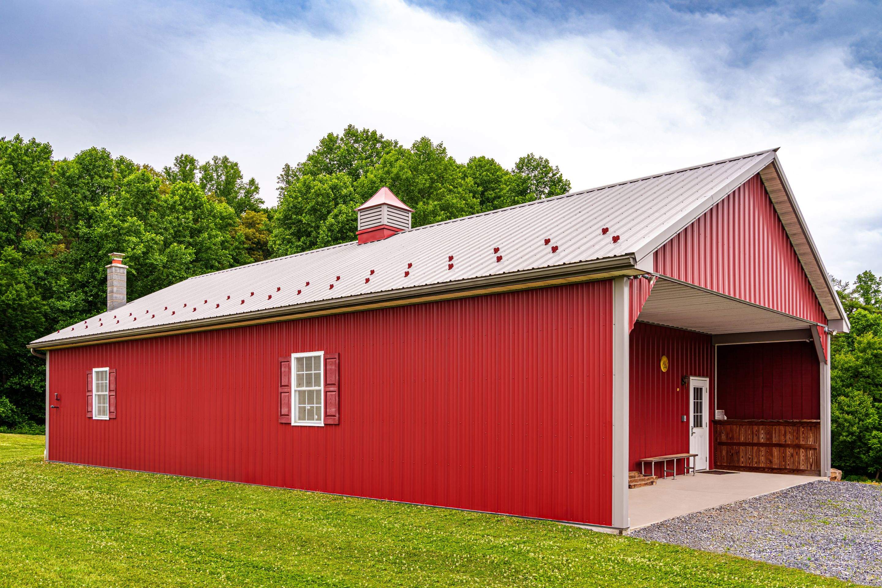 Metal roof -barn red, and New garage by Esh Builders