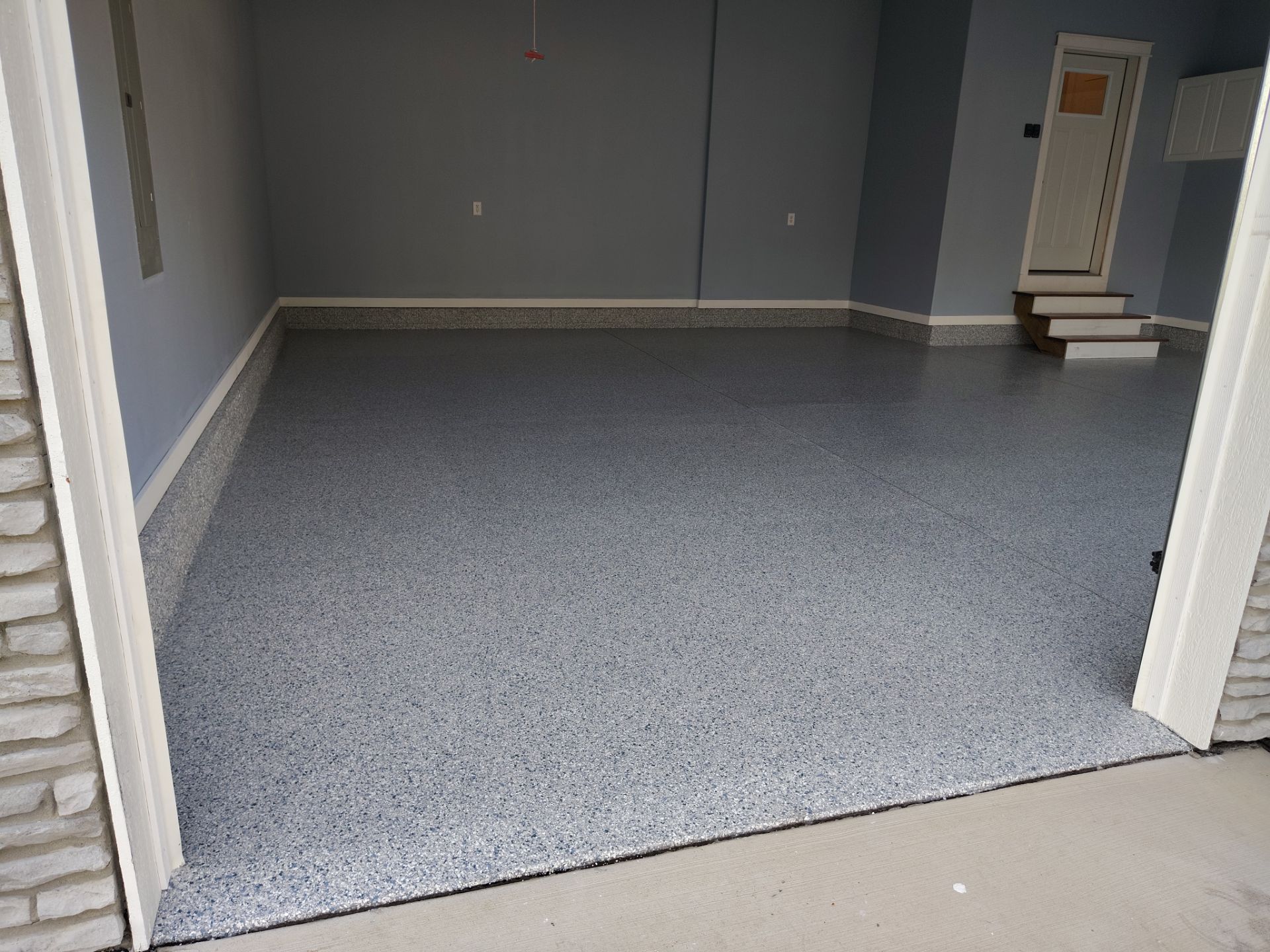 Tidal Wave Garage Transformation in Adel, Iowa by Revival Concrete Coatings