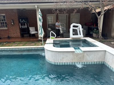 Modern Geometric Pool with Raised Spa and Travertine Deck