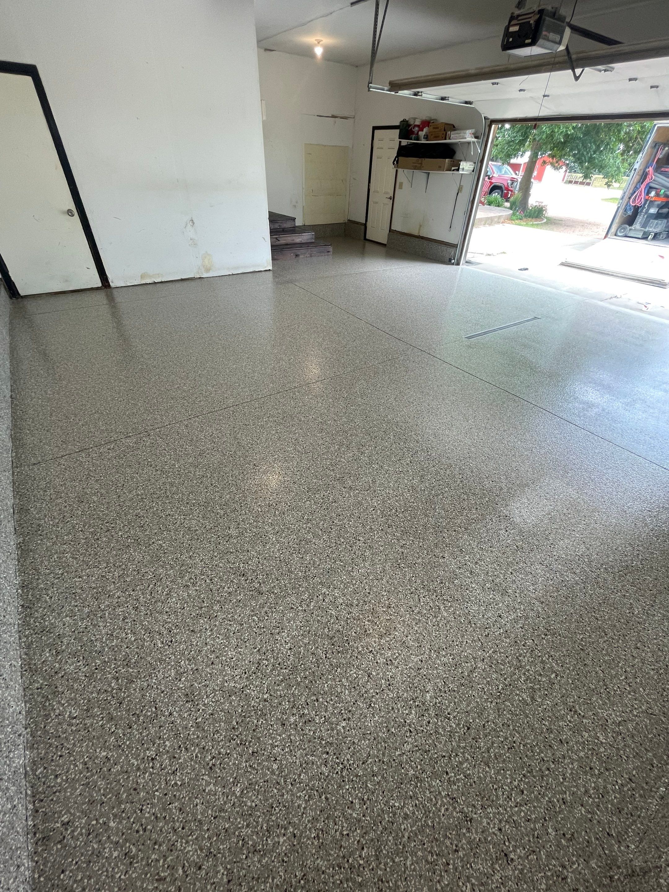 Hartford Residential Garage Floor Transformation With Decorative Chip Coating by Select Painting, Coatings & Garage Cabinets