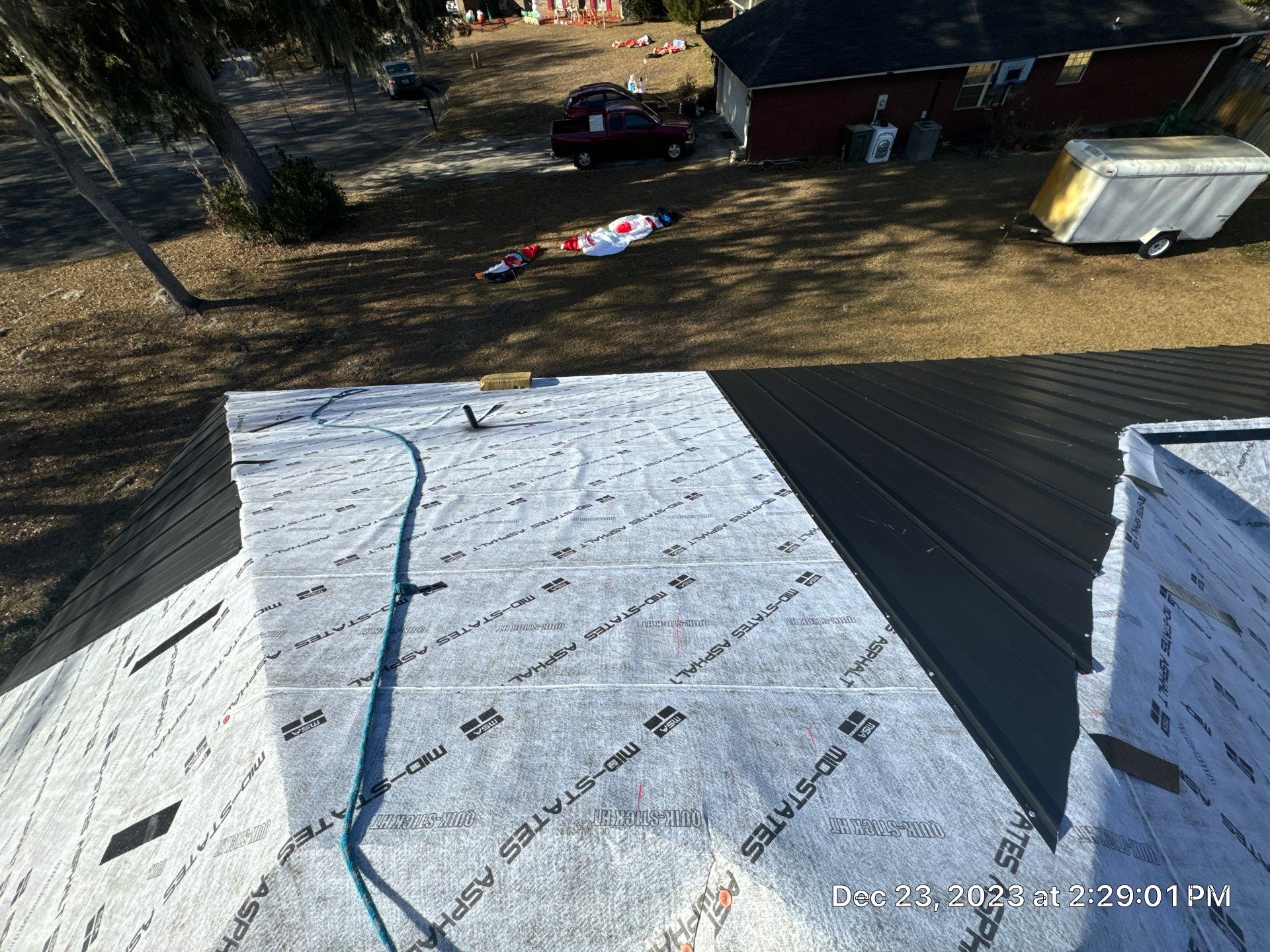 Residential Roofing Installation using Benton 26Ga 1inc Snapcock Metal Roof KYNAR Matte Black by Talya Roofing