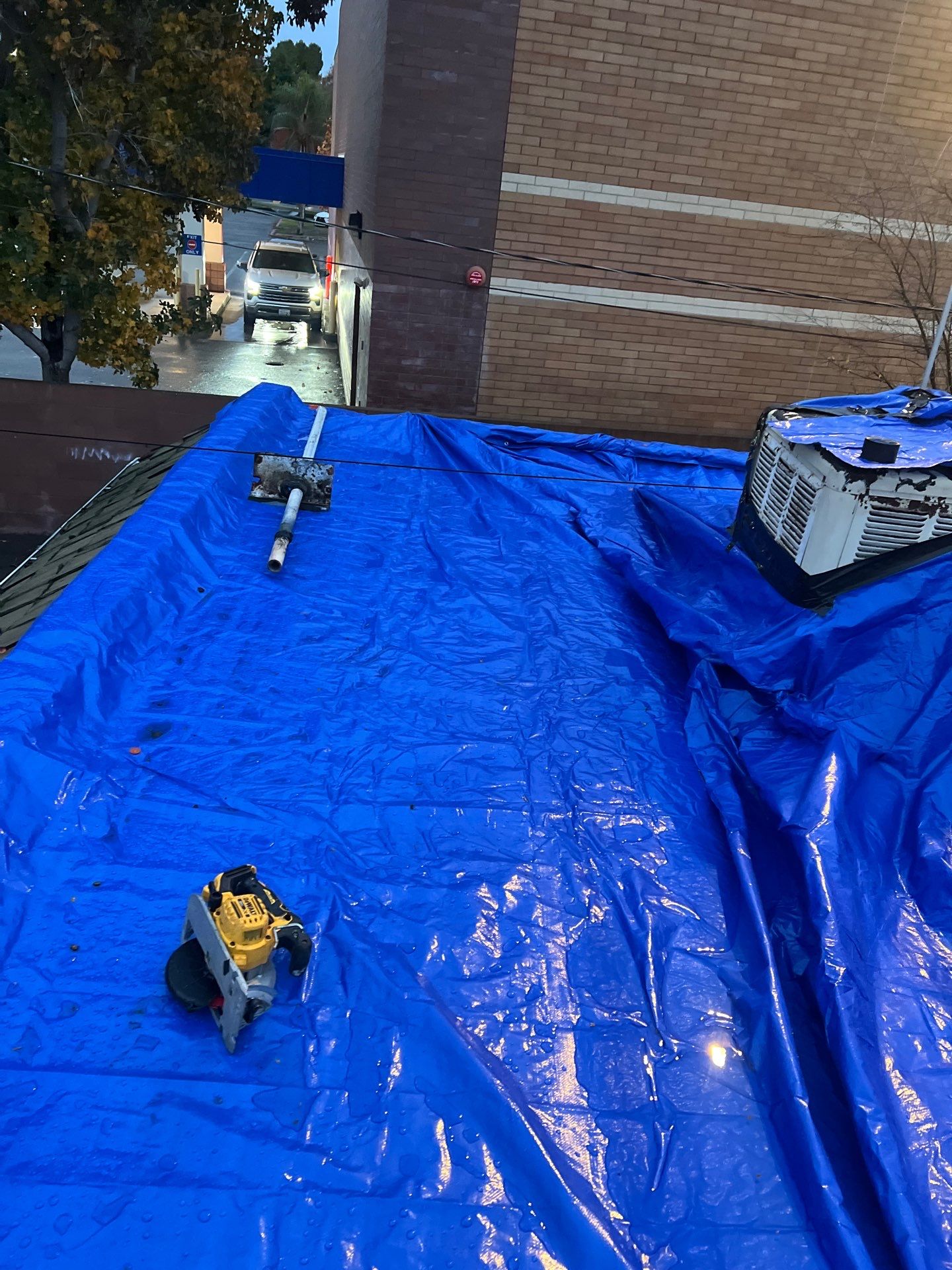 Emergency Roof Tarp Service - Fresno, CA by Grandmark Service Company