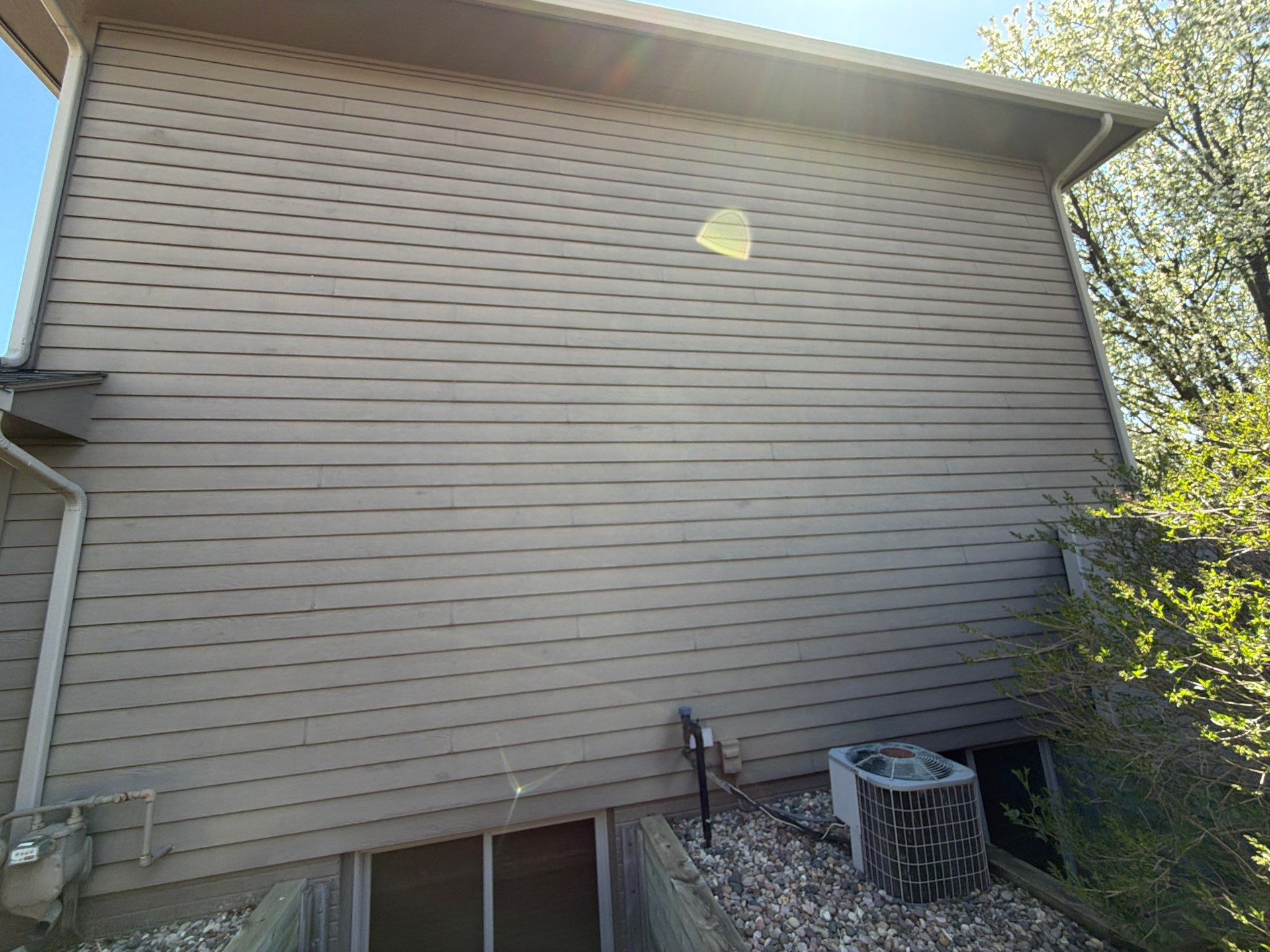 Residential Exterior Painting with Shutter and Trim Updates in Sioux Falls by Select Painting, Coatings & Garage Cabinets