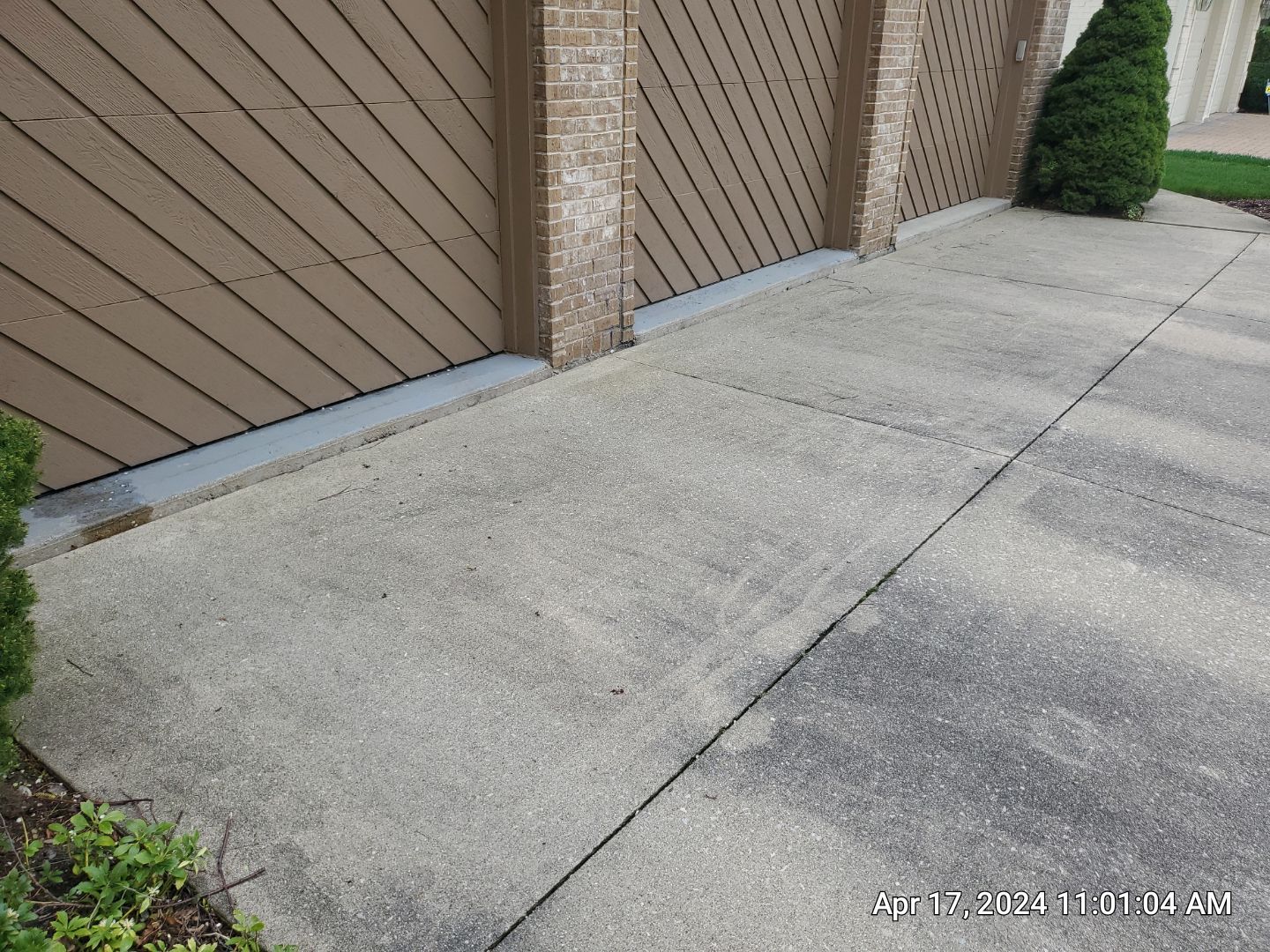 concrete patio and driveway cleaning by Northern Power Washing LLC.