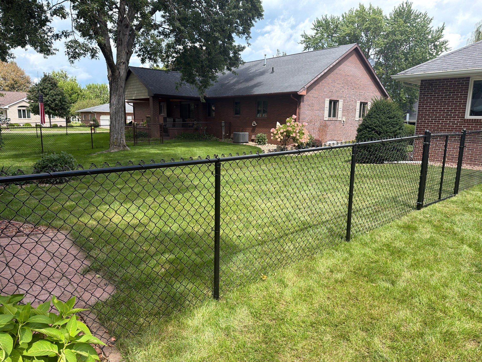 Residential White Vinyl Privacy and Black Chain Link Fencing in Jesup by Perfect Picket Fence and Stain