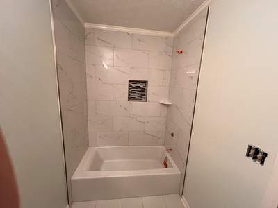 Guest bathroom tub and flooring